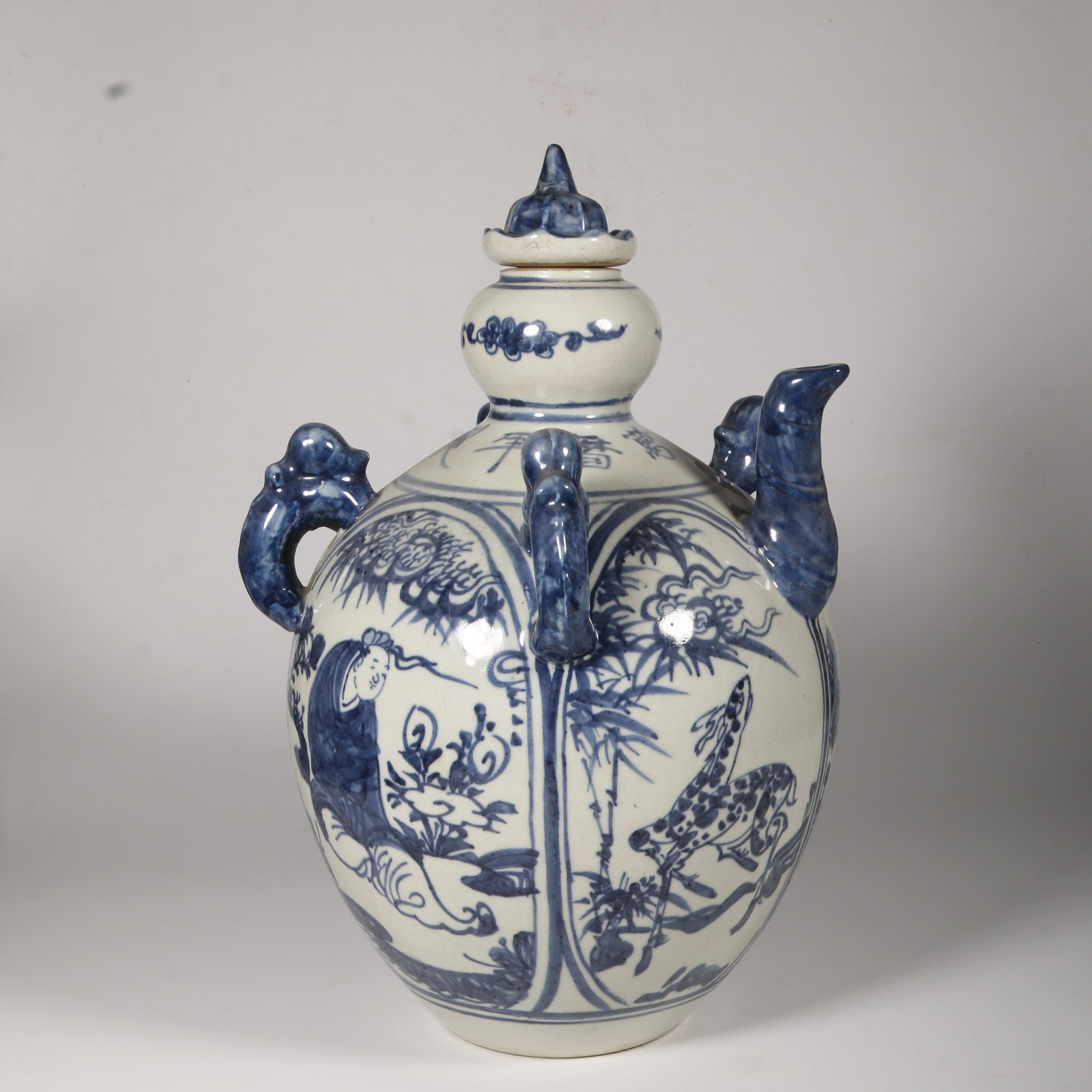 A BLUE-AND-WHITE FOUR-AFFECTIONS FOUR-HANDLED TEAPOT (1 of 14)