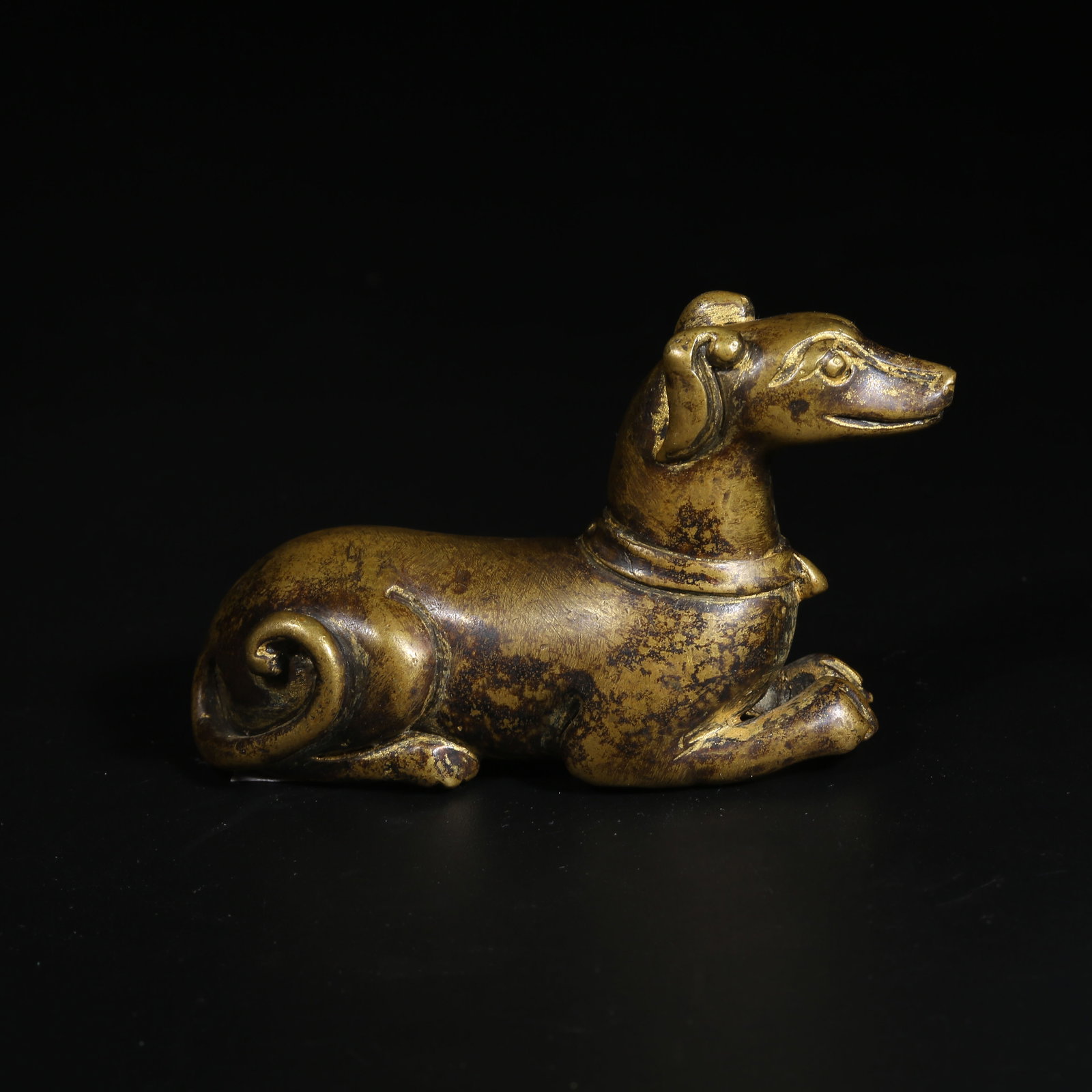 A BRONZE PAPERWEIGHT IN THE FORM OF A RECLINING DOG (1 of 8)