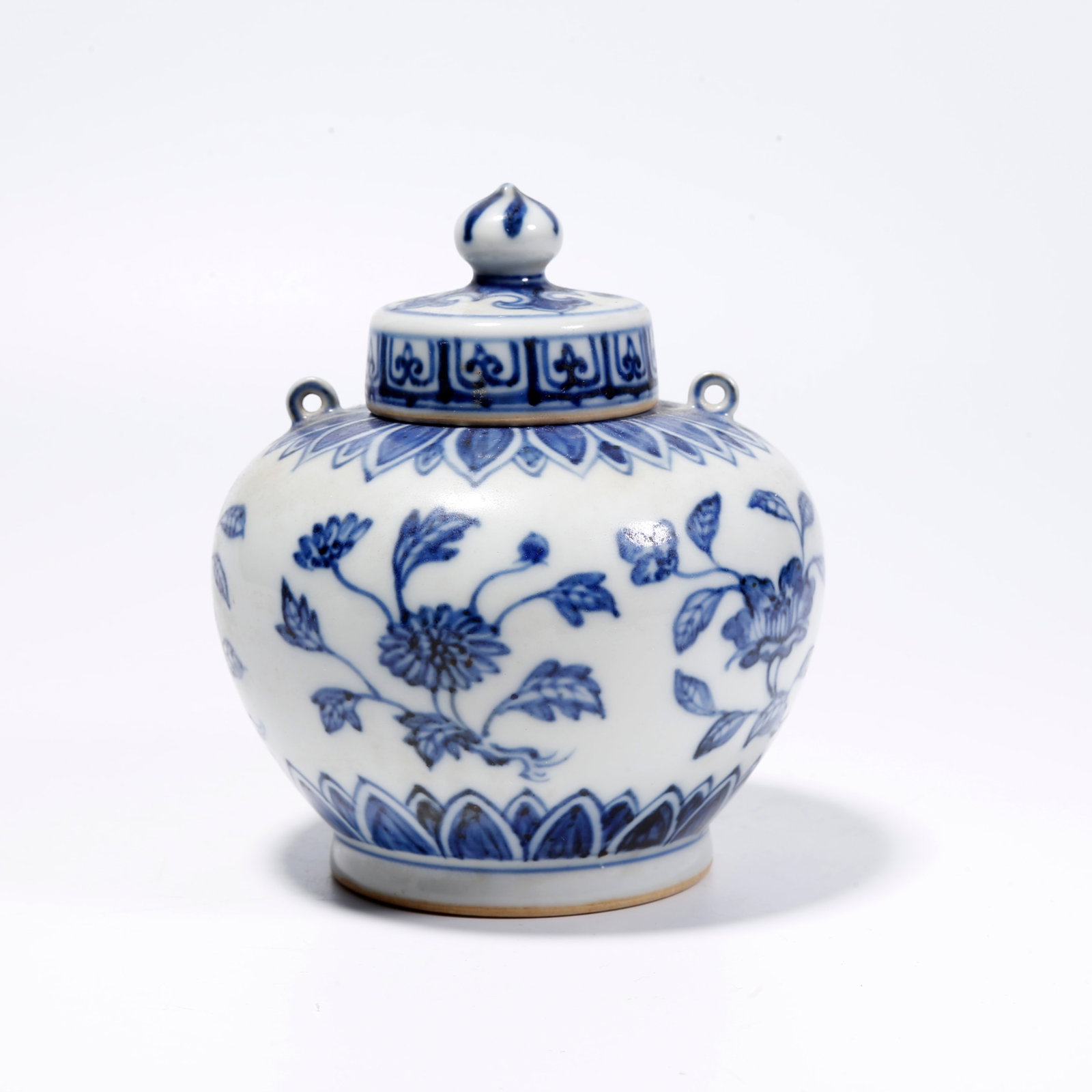 A BLUE-AND-WHITE COVERED JAR WITH FLOWER AND PLANT PATTERN (1 of 9)