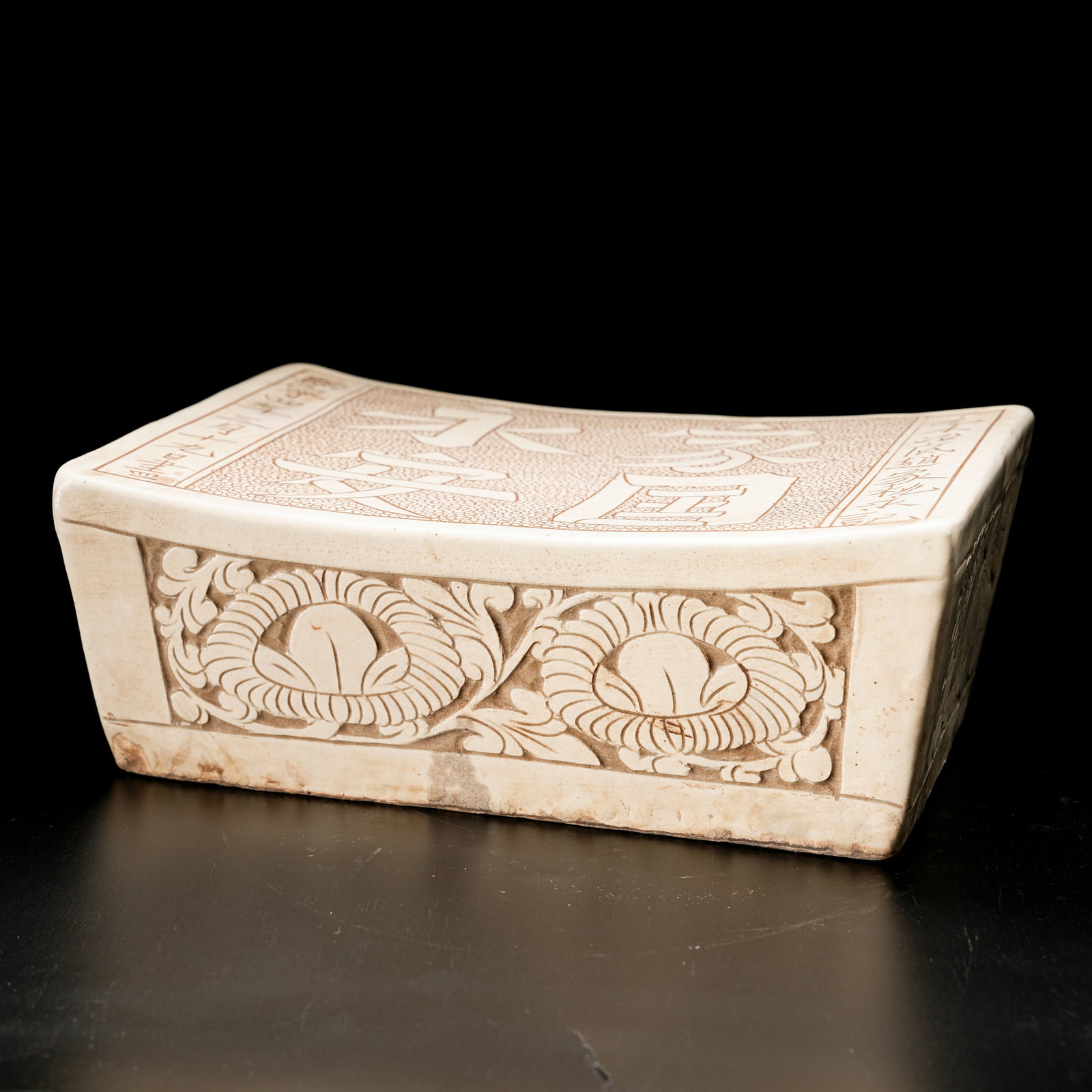 A WHITE PORCELAIN PILLOW WITH "NATION IN ETERNAL PEACE" MOTIF (1 of 9)