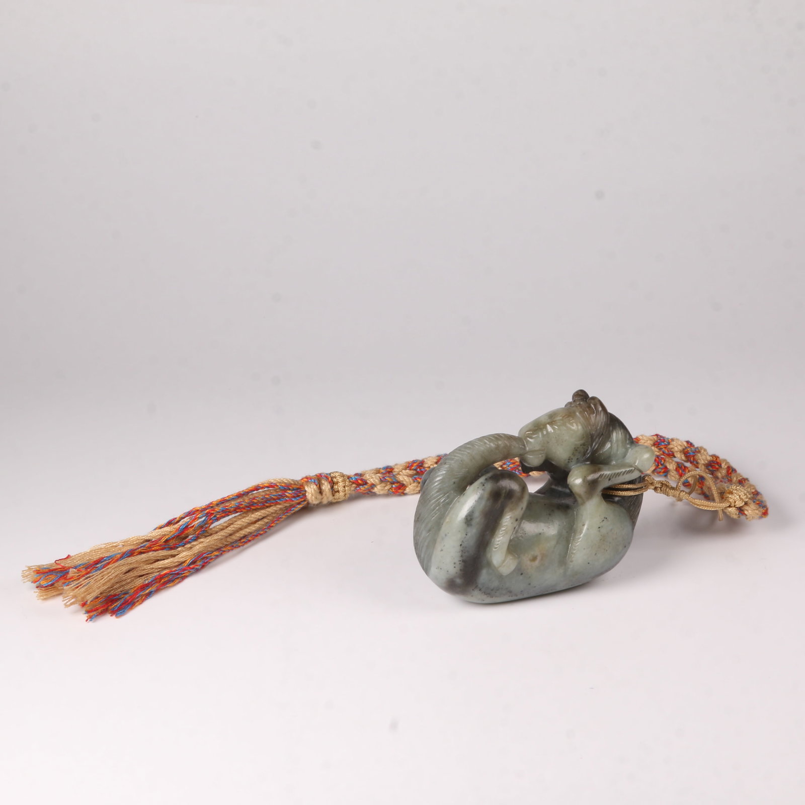A HETIAN JADE HORSE-SHAPED PENDANT (1 of 12)