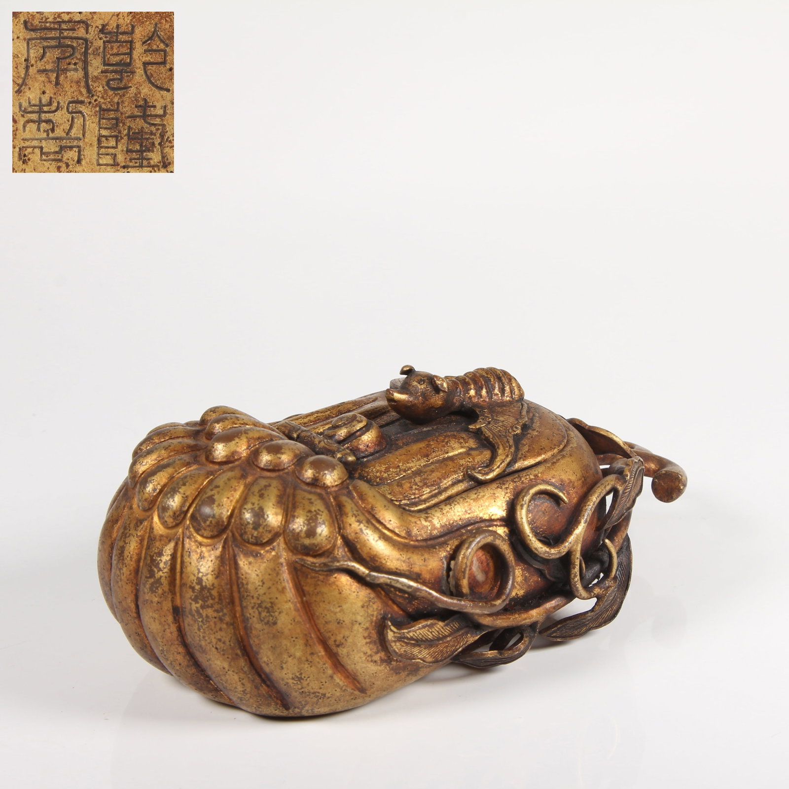 A GILT-BRONZE WASHER WITH LONGEVITY AND HAPPINESS MOTIF: Gilt-Bronze Washer with Longevity and Happiness Motif