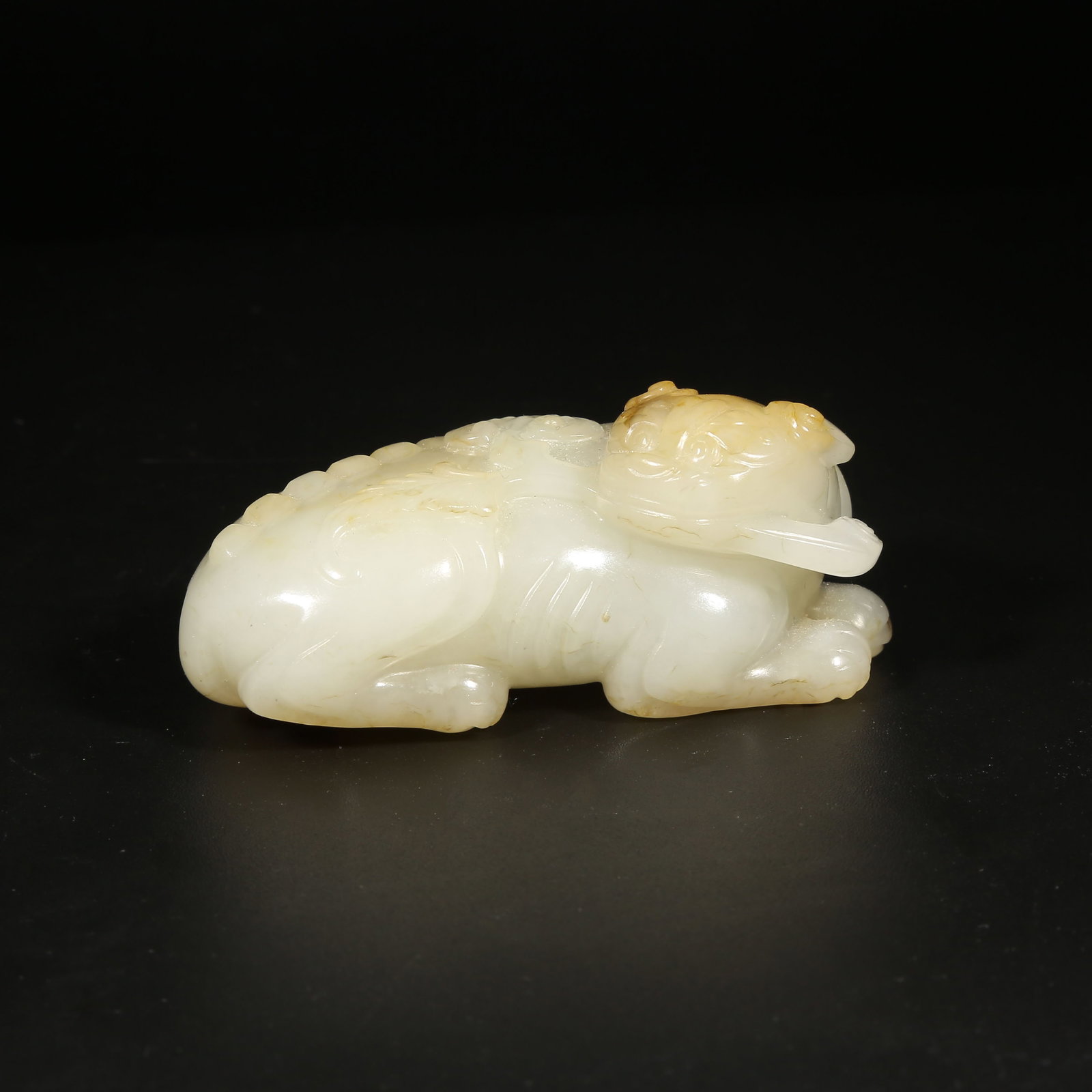 A HETIAN JADE AUSPICIOUS BEAST ORNAMENT (1 of 8)