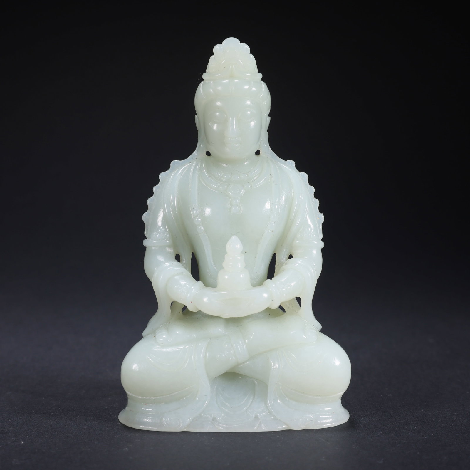 A HETIAN JADE SEATED BUDDHA (1 of 9)