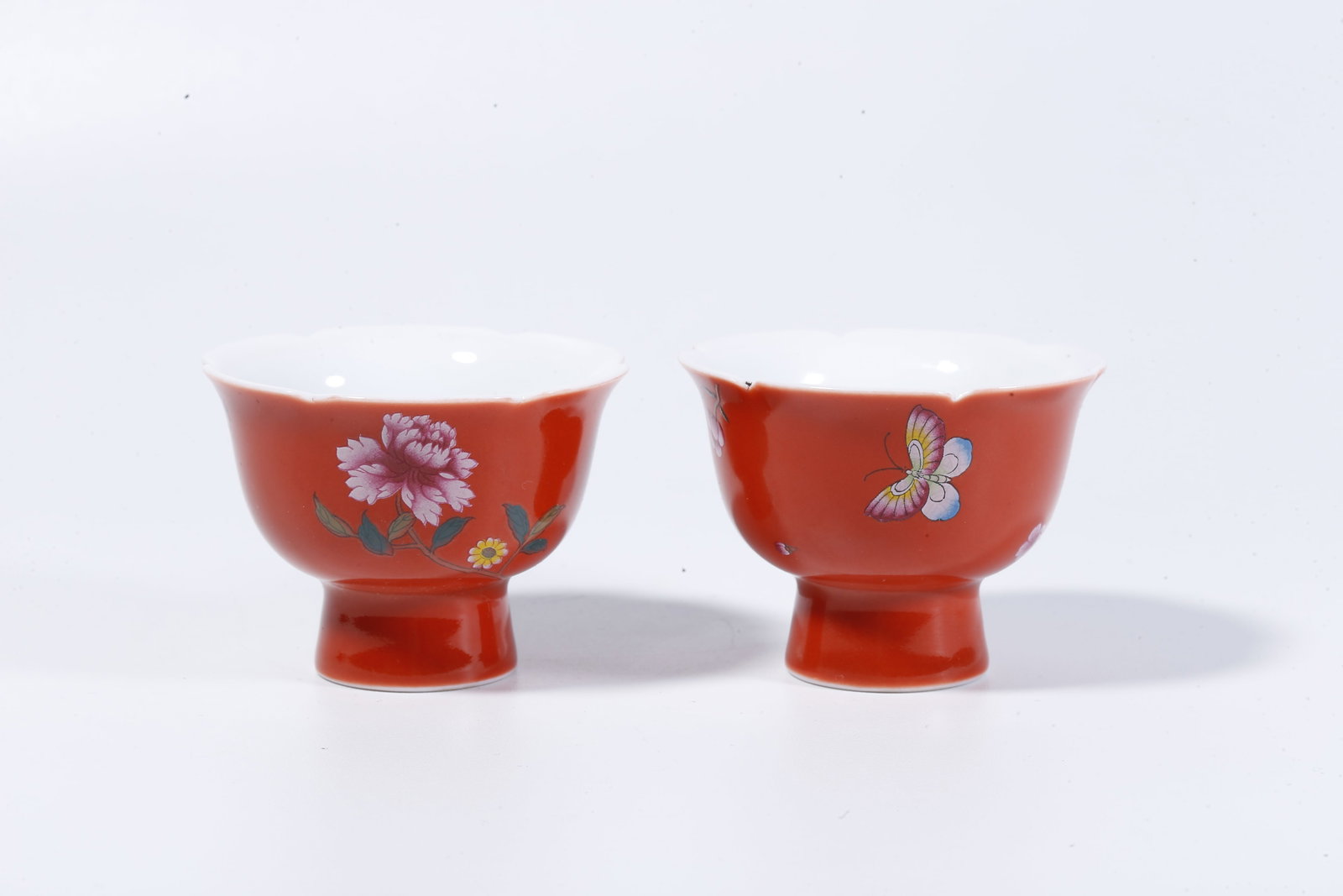 A CARMINE-RED GLAZED CUPS WITH FLORAL DECORATION (PAIR) (1 of 9)