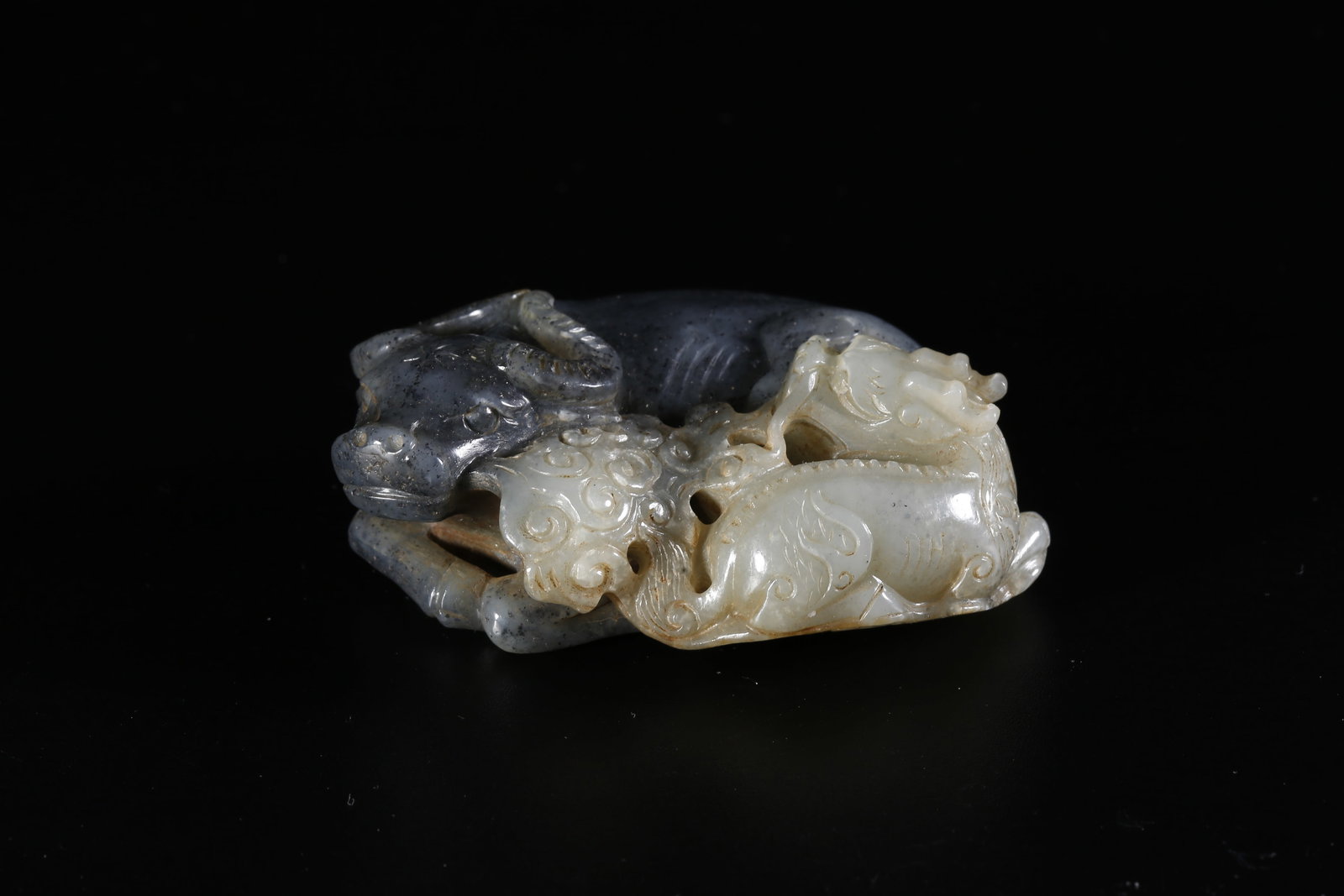 A HETIAN JADE FINELY CARVED BEAST-FORM ORNAMENT (1 of 9)