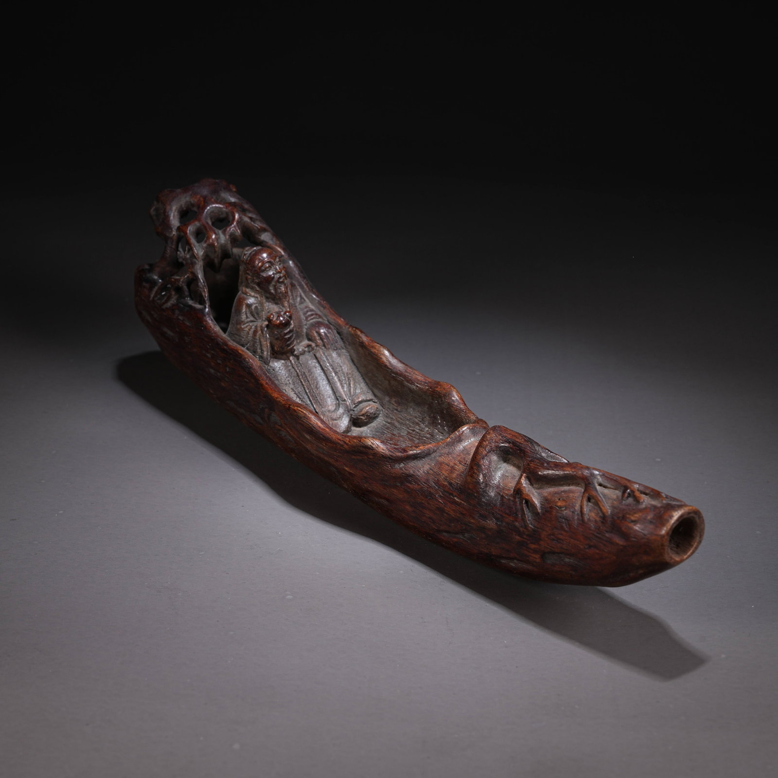 A HUANGHUALI CARVING OF AN ELDER RIDING A BOAT (1 of 7)