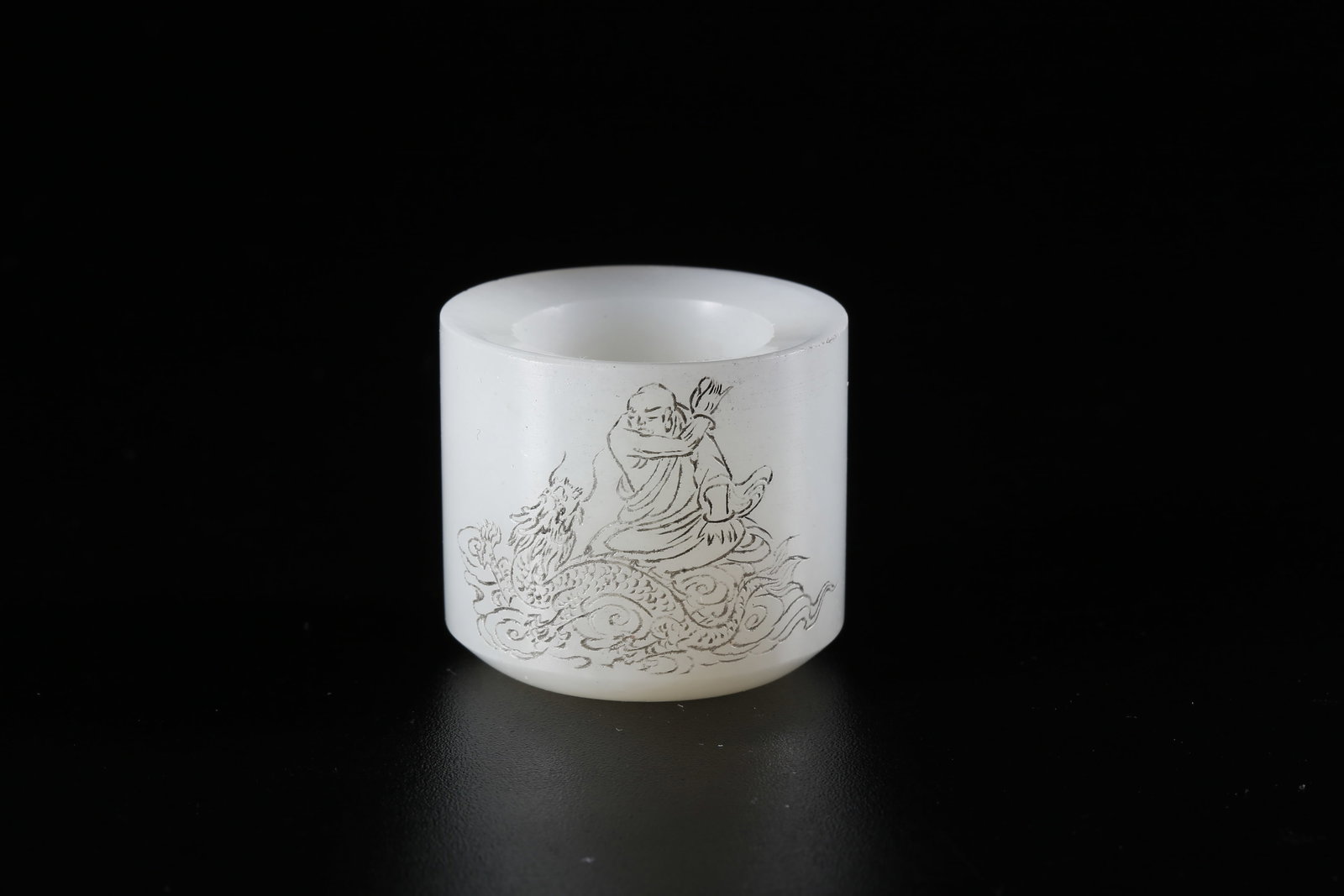 A HETIAN JADE CARVED FINGER RING WITH DRAGON-SUBDUING ARHAT MOTIF (1 of 9)