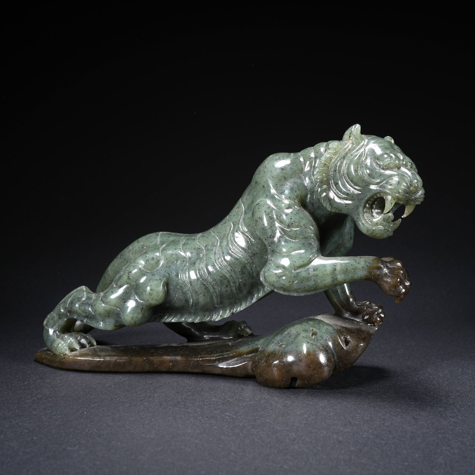 A HETIAN GREEN JADE TIGER-SHAPED ORNAMENT (1 of 9)