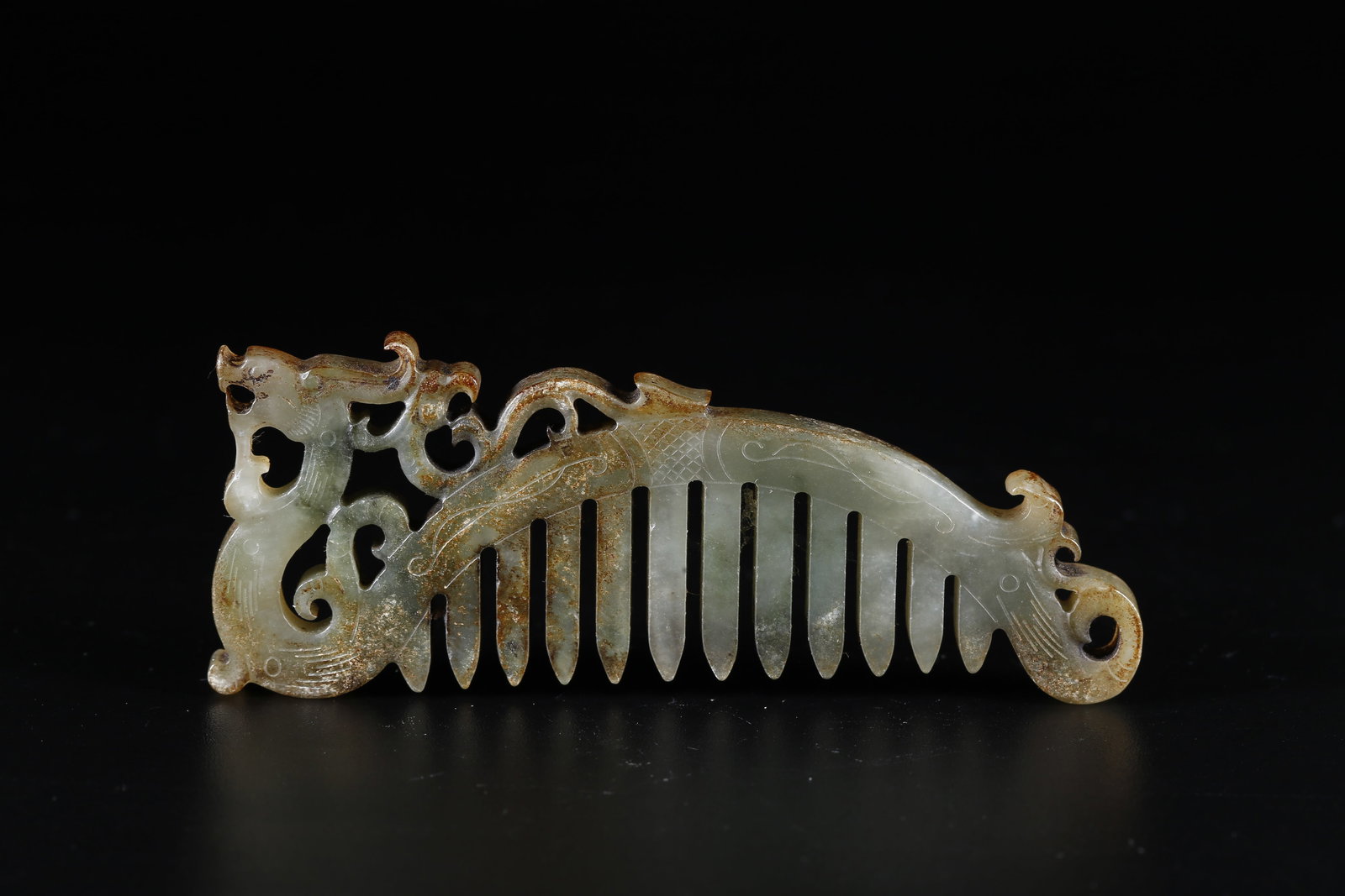 A HETIAN JADE DRAGON-SHAPED COMB (1 of 9)