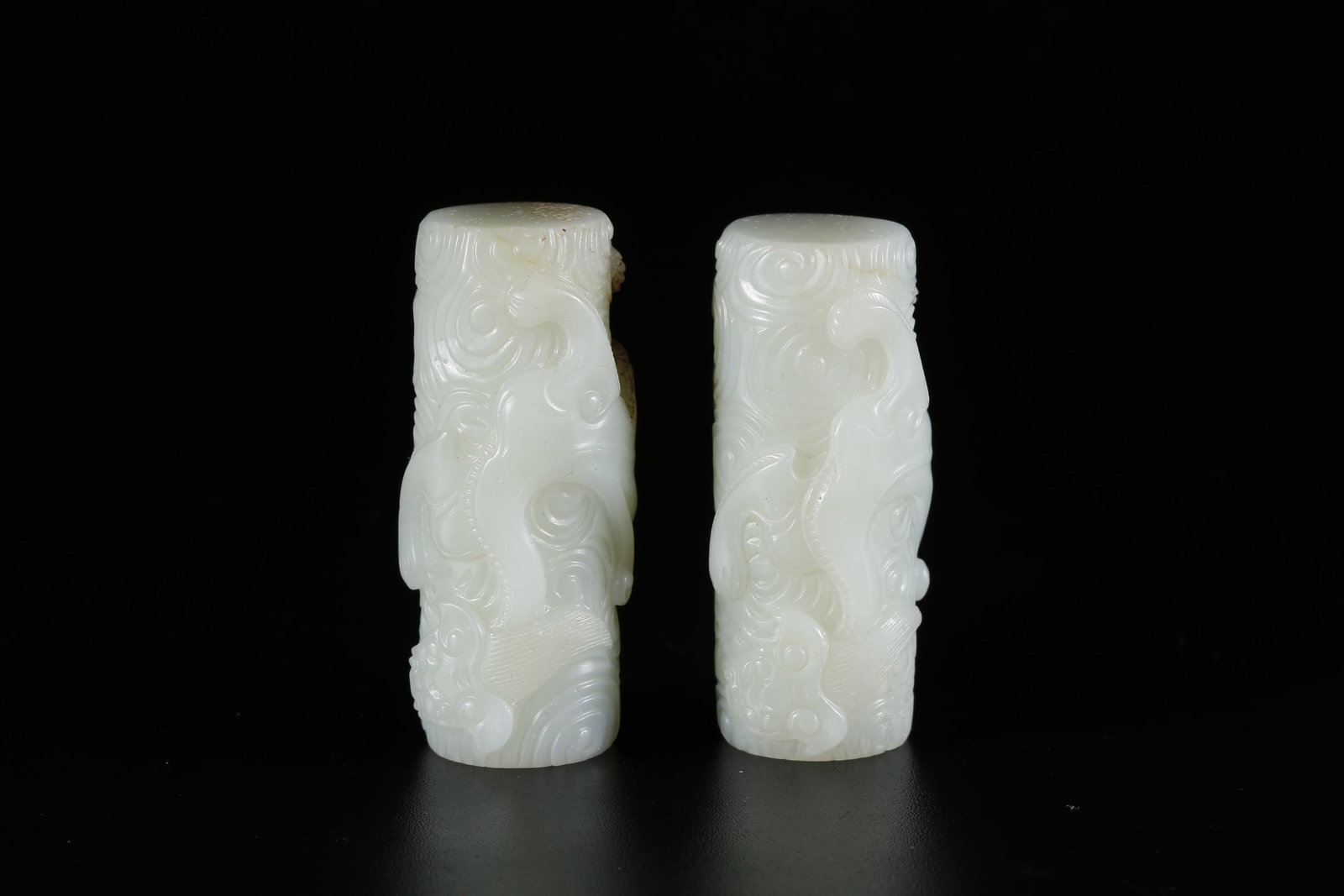 A PAIR OF HETIAN JADE CARVED DRAGON PAPERWEIGHTS (1 of 9)