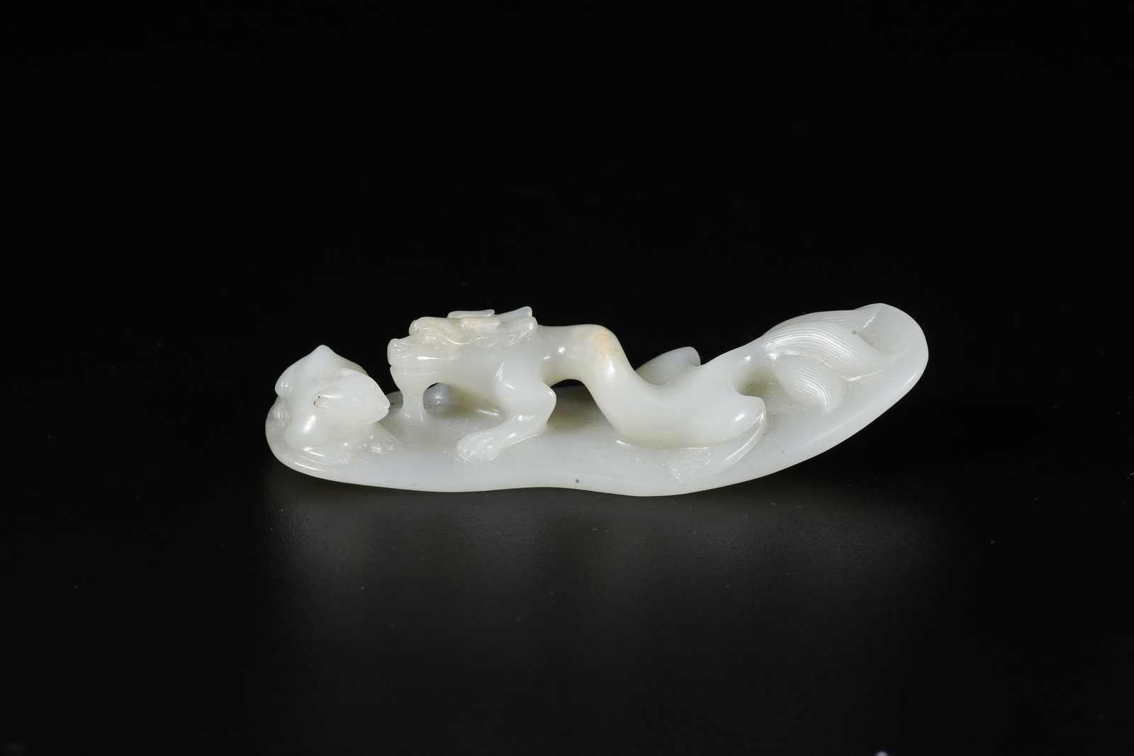 A HETIAN JADE CARVED BEAST-SHAPED ORNAMENT (1 of 10)