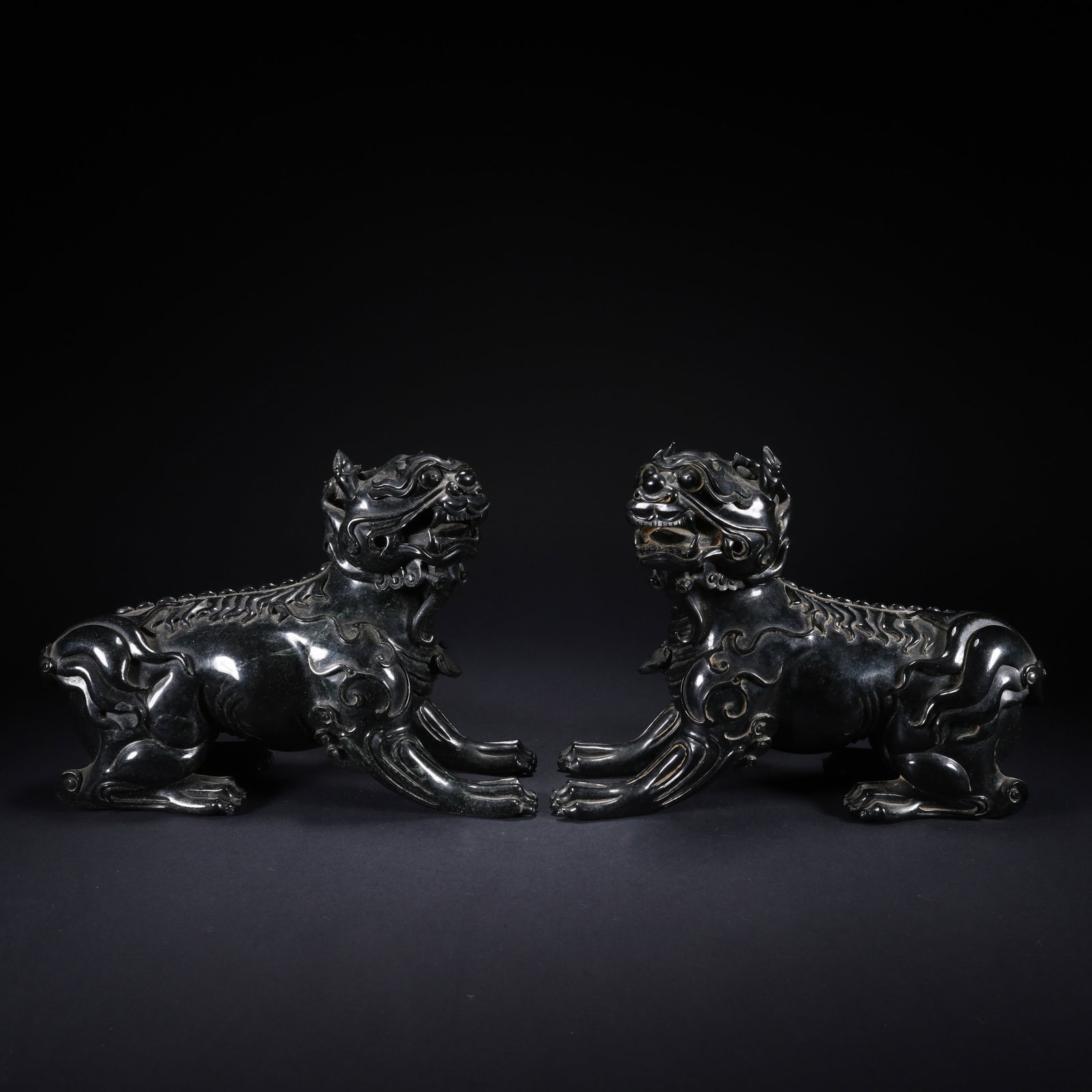 A HETIAN JASPER LION PAIR (1 of 9)