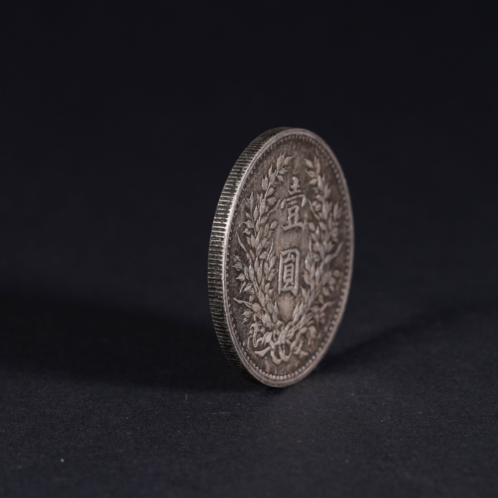 A SILVER DOLLAR COIN - 3