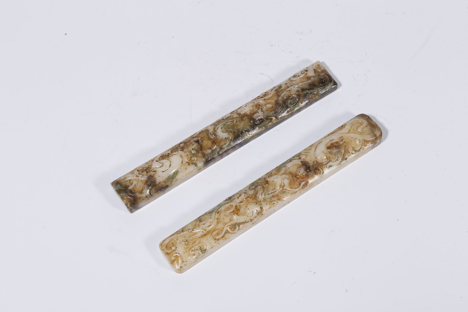 A ARCHAIC JADE CARVED DRAGON-PATTERN PAPERWEIGHTS (PAIR) (1 of 9)