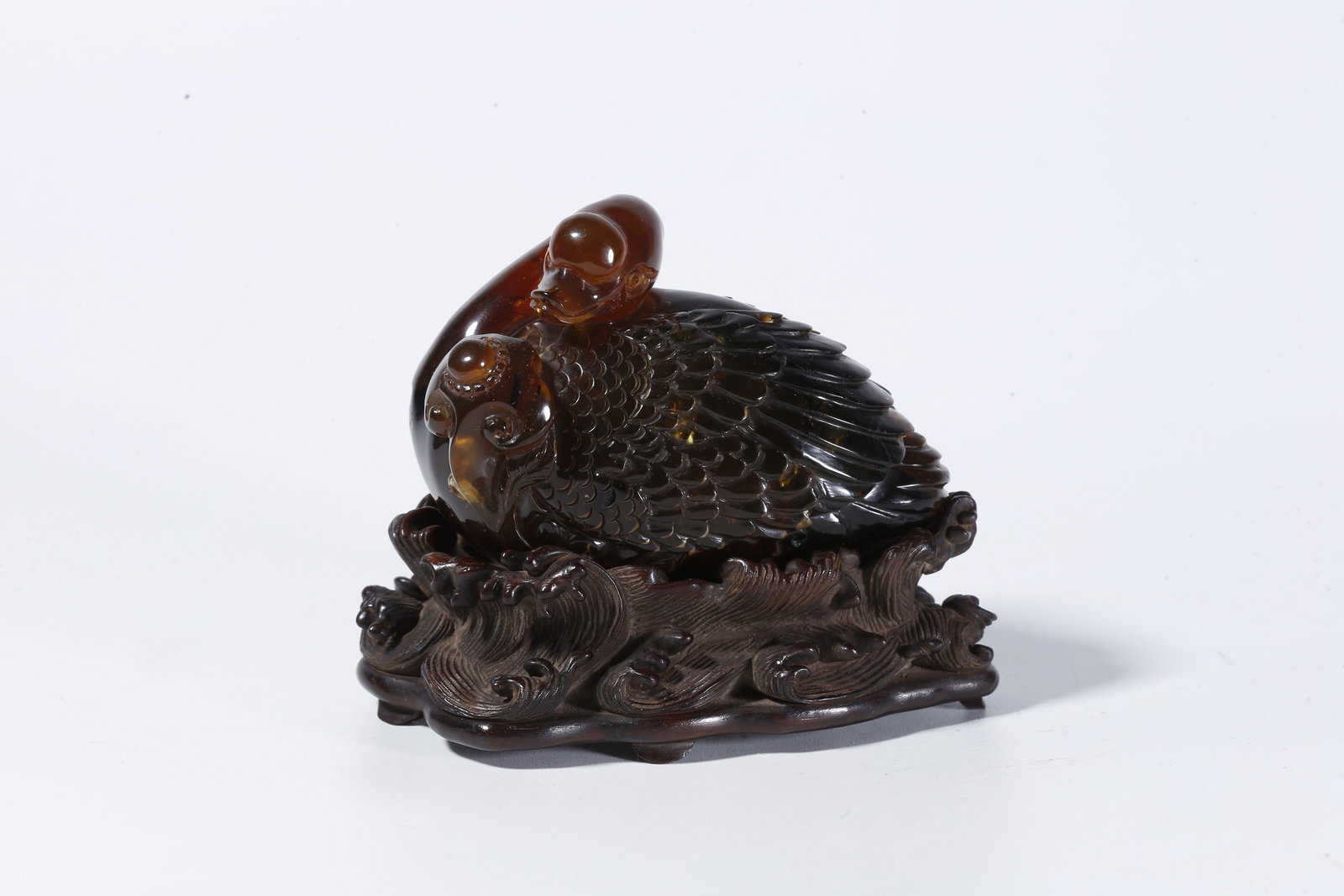 A AMBER CARVED GOOSE-FORM ORNAMENT (1 of 10)