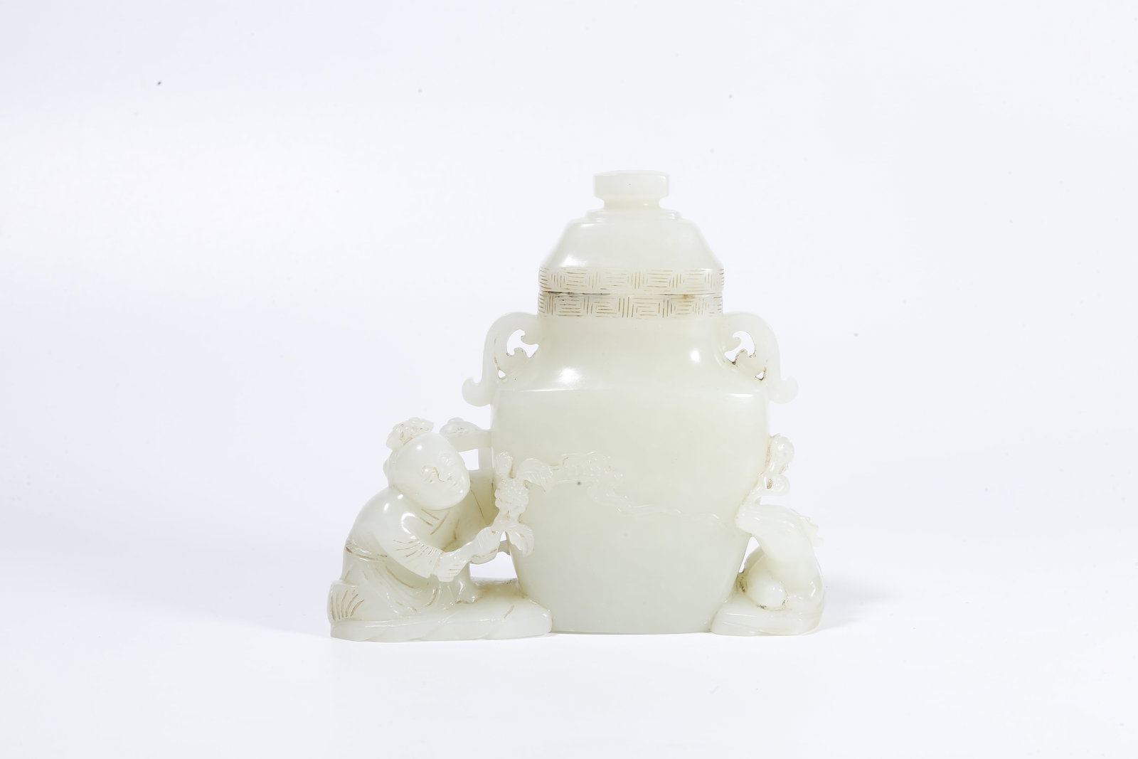 A HETIAN JADE LIDDED JAR CARVED WITH BOY AND BEAST MOTIFS (1 of 10)