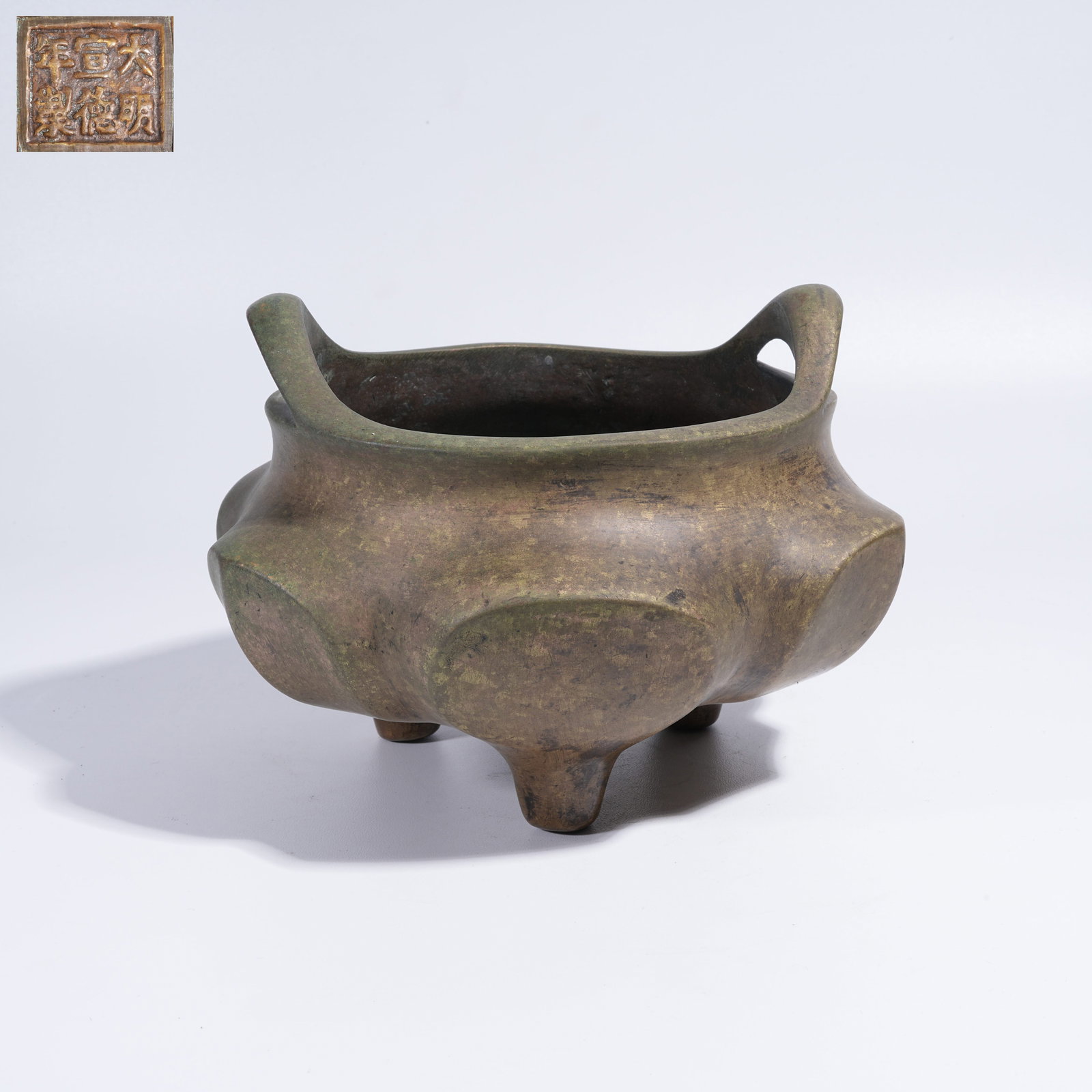 A BRONZE TRIPOD CENSER WITH LOTUS PETAL DECORATION (1 of 9)