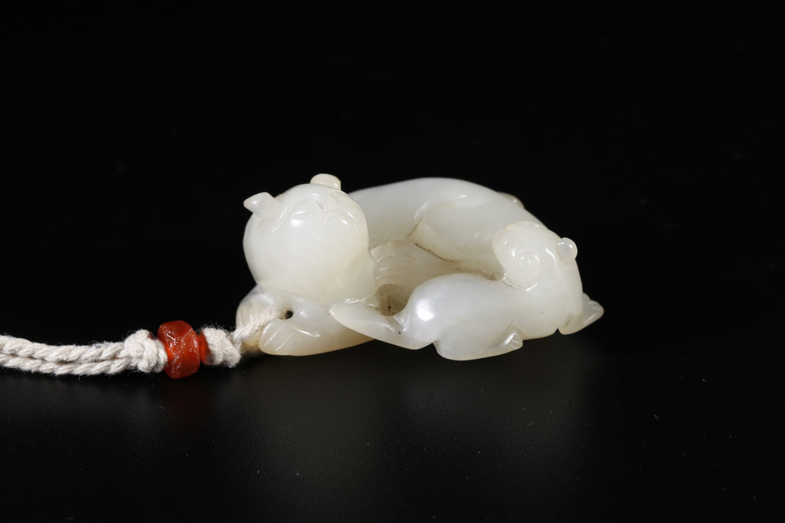 A HETIAN JADE ORNAMENT IN ADULT AND YOUNG LION FORM: Hetian Jade Ornament in Adult and Young Lion Form