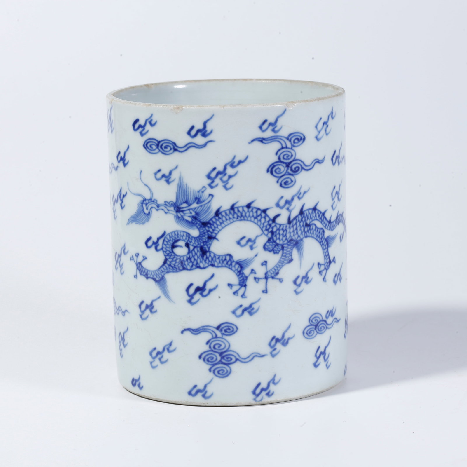 A BLUE-AND-WHITE BRUSH POT WITH CLOUD AND DRAGON MOTIFS (1 of 9)
