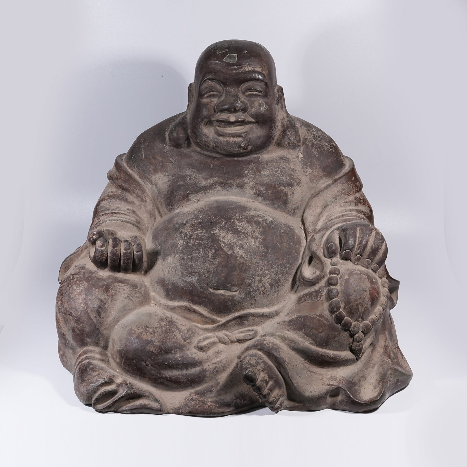 A BRONZE SEATED BUDAI (LAUGHING MONK) STATUE (1 of 9)