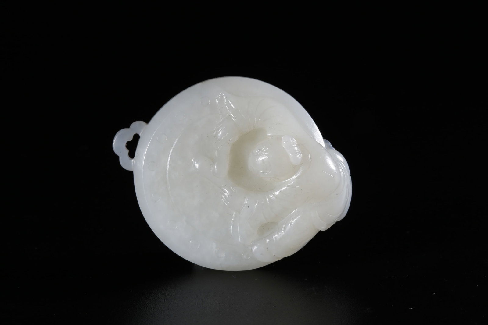 A HETIAN JADE CARVED CHILD MOTIF PENDANT (1 of 9)