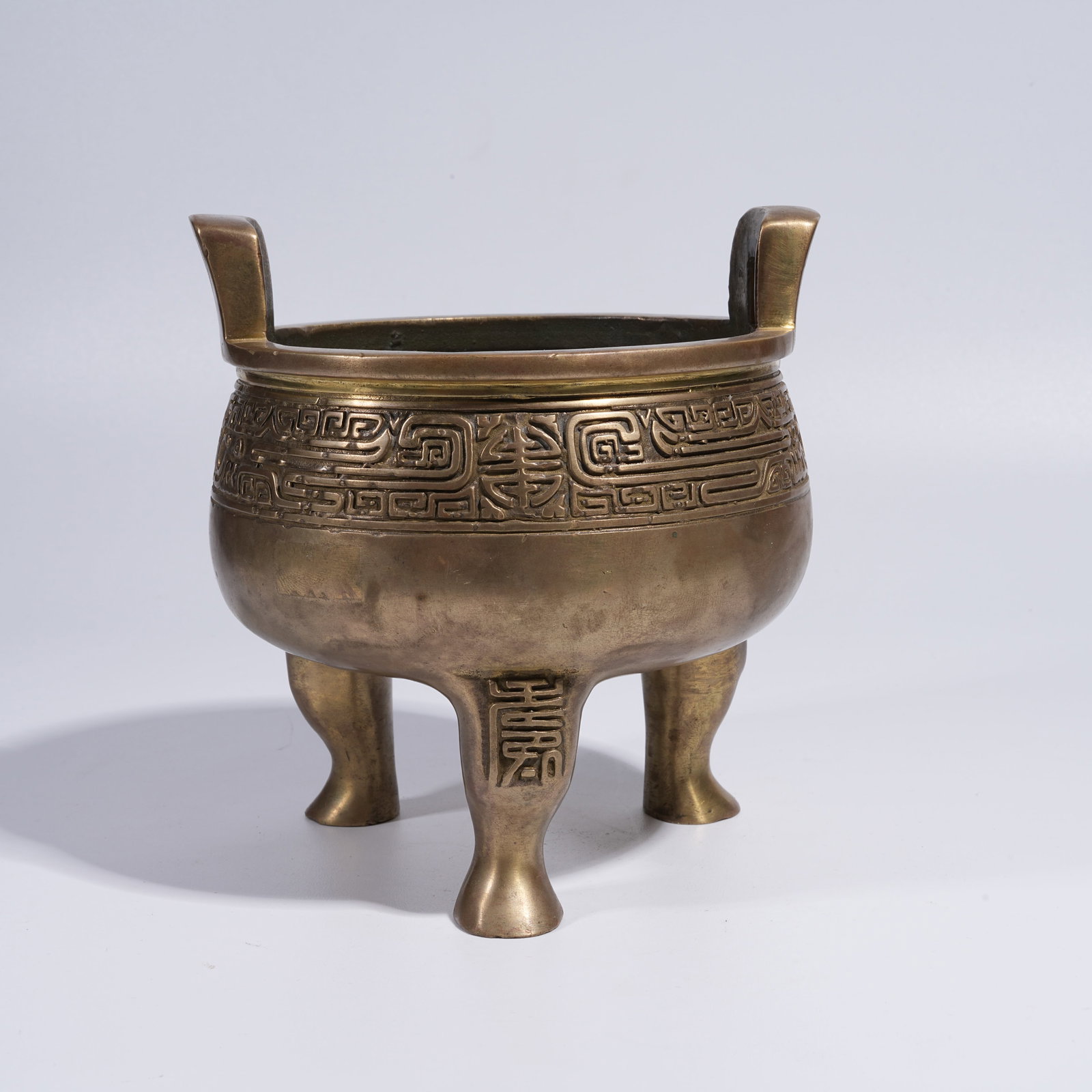 A GILT BRONZE TRIPOD INCENSE BURNER WITH BEAST-FACE DECORATION (1 of 10)