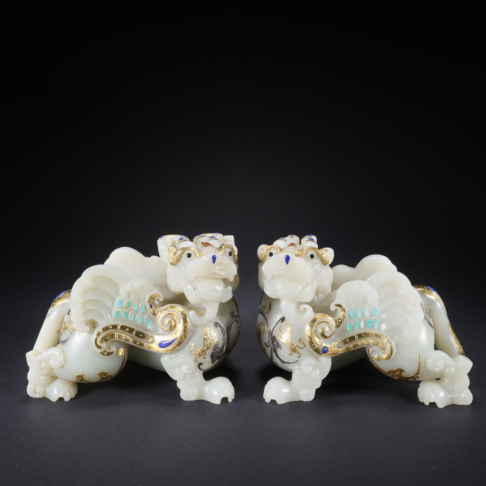 A HETIAN JADE AUSPICIOUS BEAST PAIR INLAID WITH GOLD, SILVER, AND PRECIOUS STONES (1 of 9)
