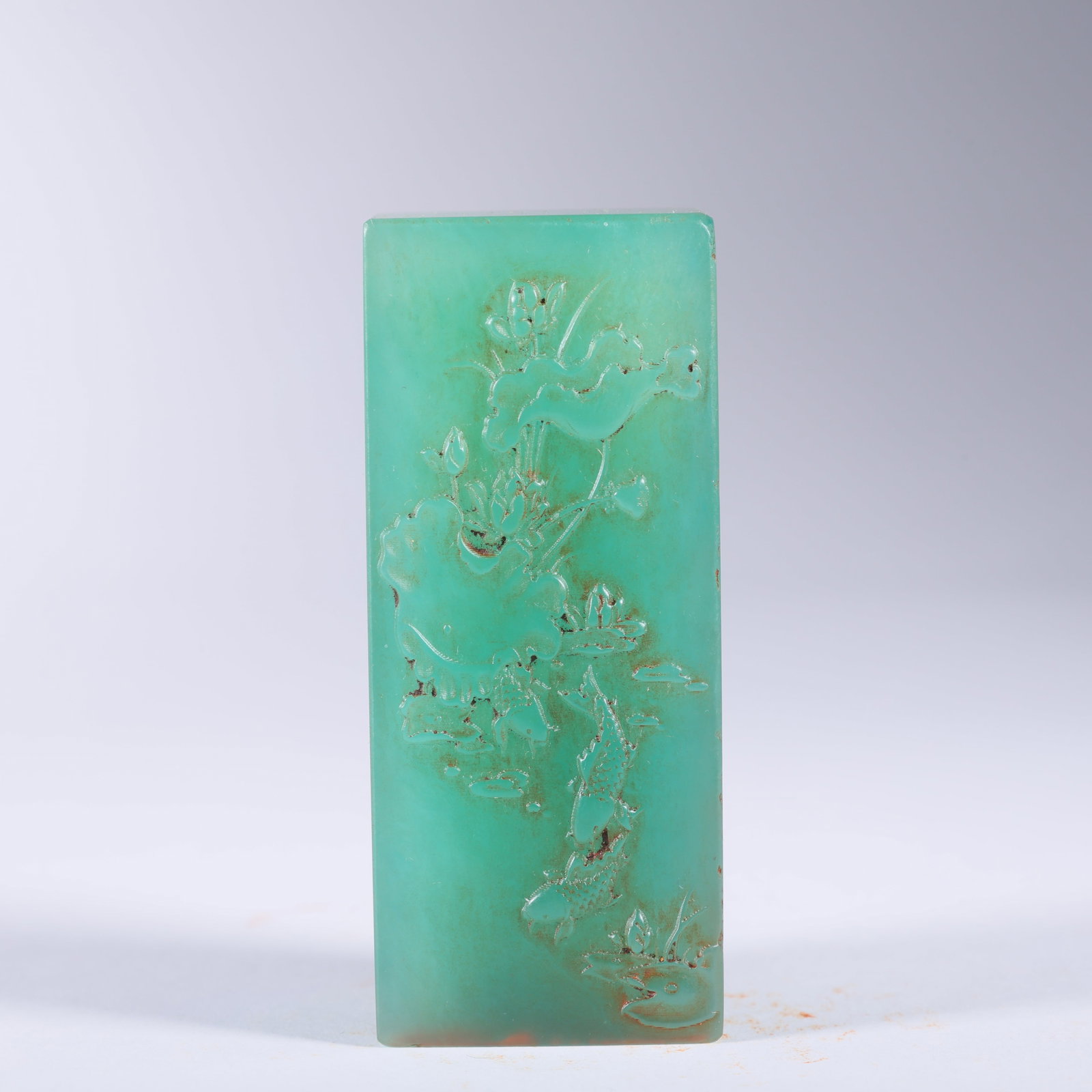 A SHOUSHAN STONE "YA‘AN GREEN" SEAL WITH TWO FISH PLAYING WITH LOTUS (1 of 9)