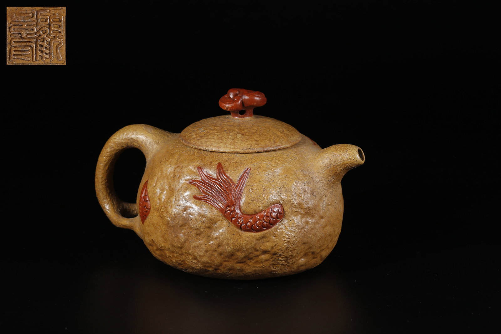 A ZISHA CLAY CARVED FISH-TO-DRAGON TRANSFORMATION TEAPOT: Zisha Clay Carved Fish-to-Dragon Transformation Teapot