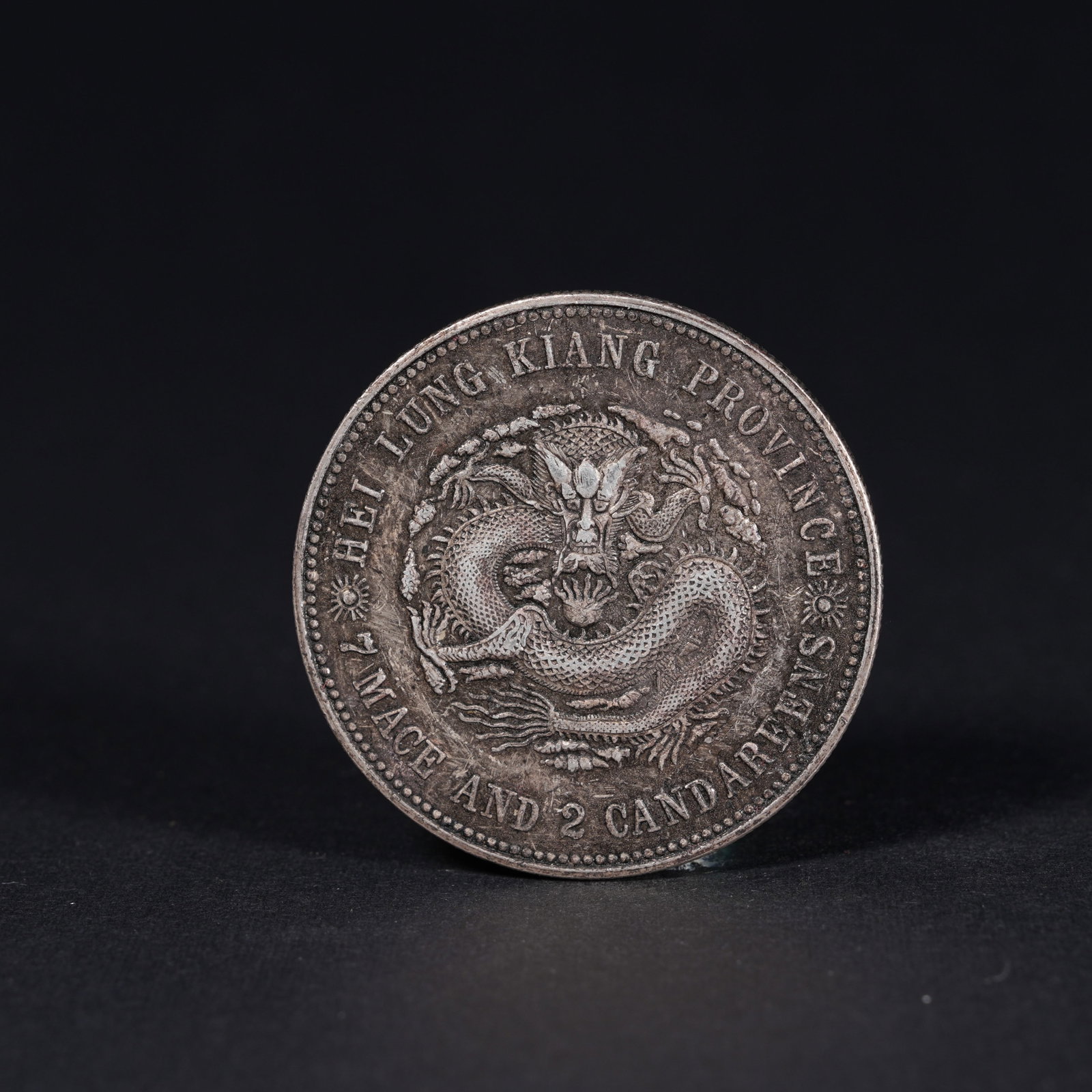 A SILVER DOLLAR COIN: One Silver dollar Coin