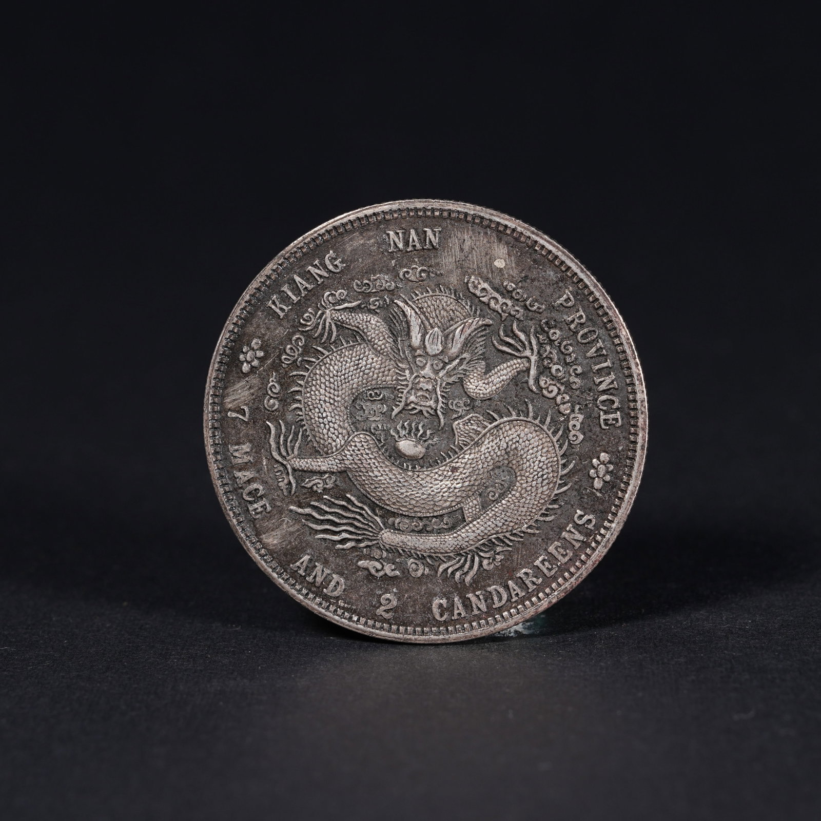 A SILVER DOLLAR COIN: One Silver dollar Coin