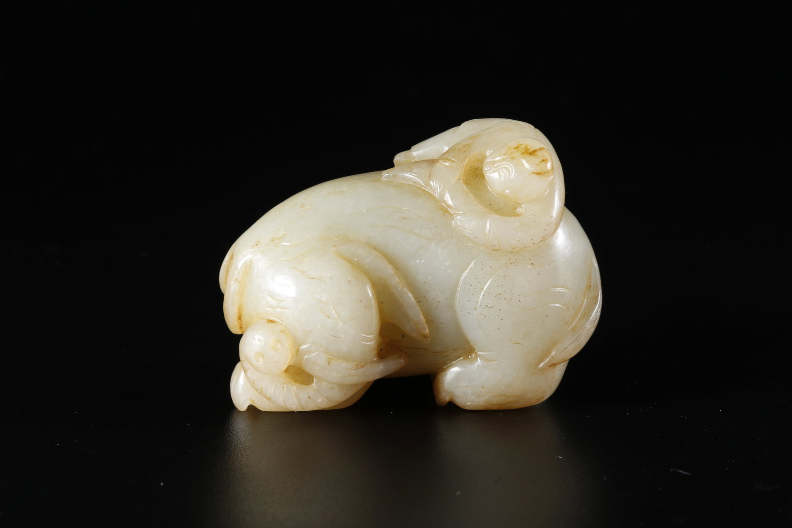 A HETIAN JADE CARVED CHILD-FORM XIANG ORNAMENT (1 of 9)