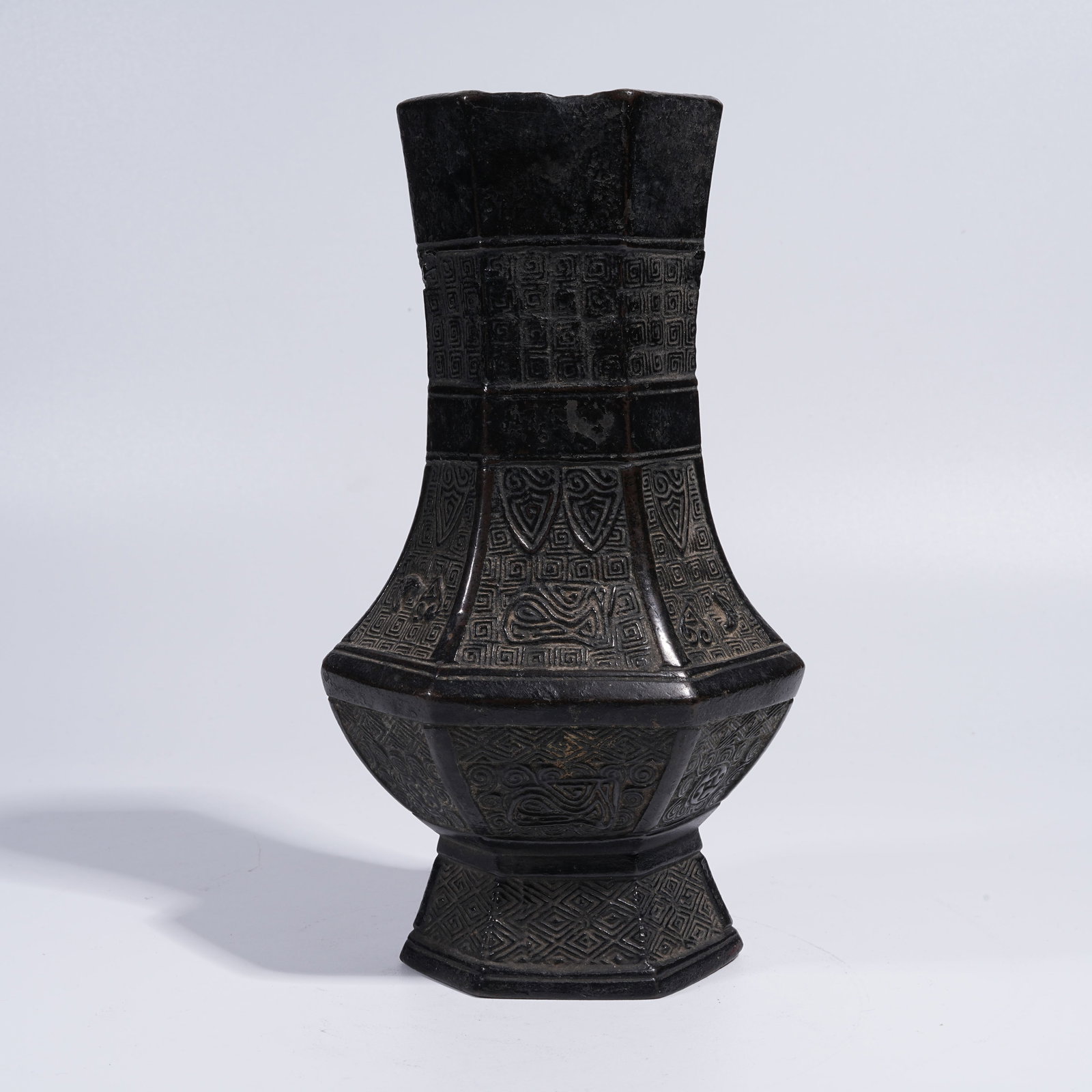 A BRONZE HEXAGONAL VASE WITH BEAST-FACE DECORATION (1 of 9)