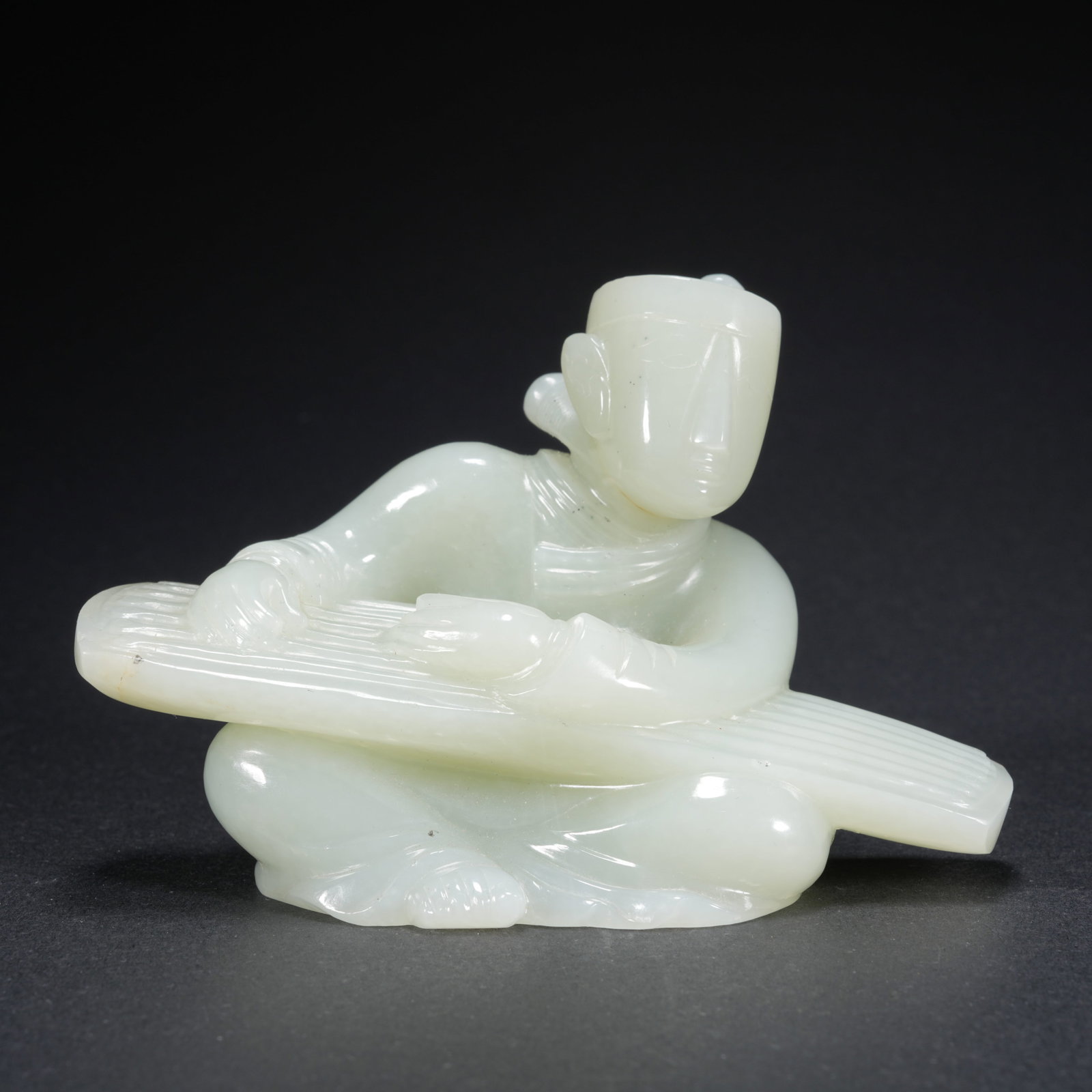 A HETIAN JADE CARVED FIGURAL FIGURE (1 of 9)