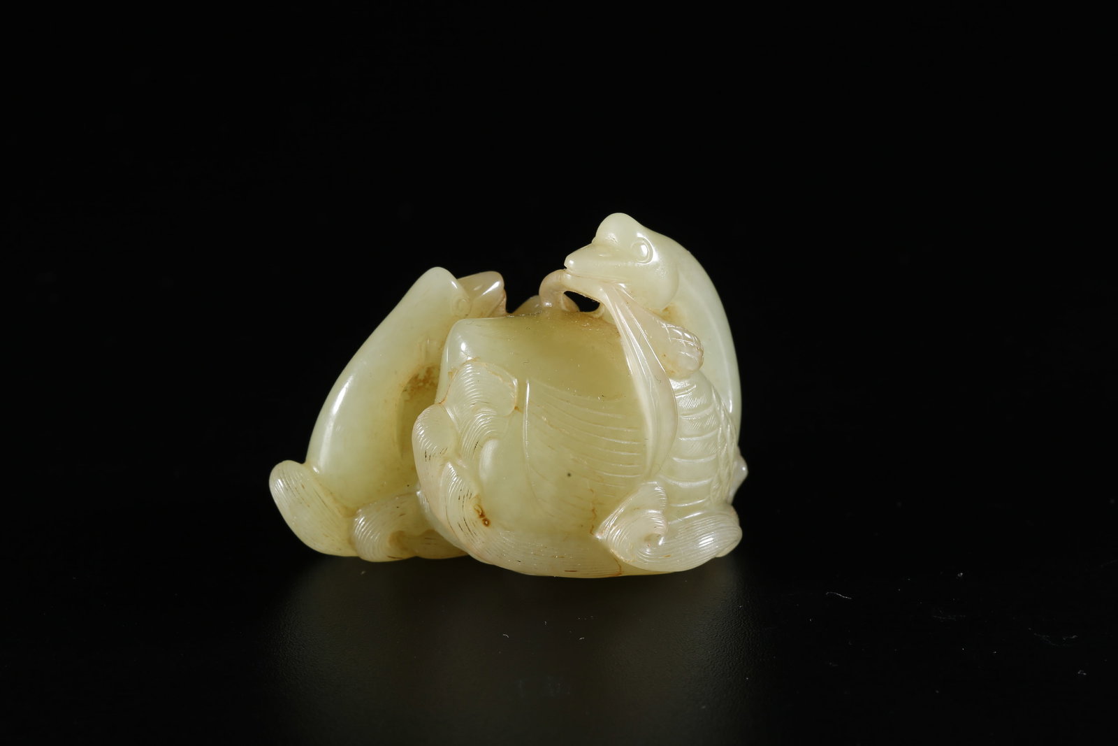 A HETIAN YELLOW JADE CARVED GOOSE-FORM ORNAMENT (1 of 9)