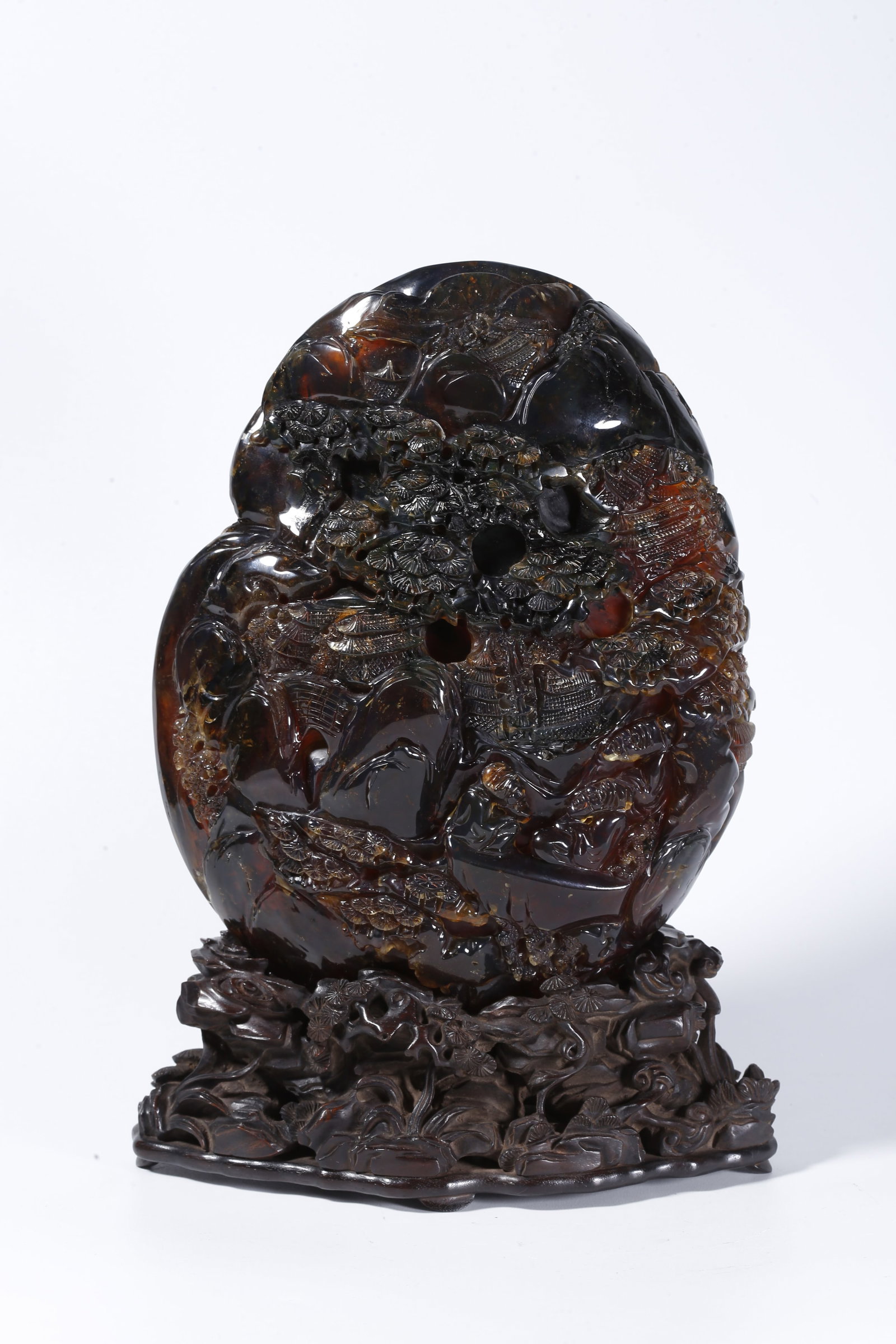 A AMBER CARVED LANDSCAPE ORNAMENT WITH FIGURES (1 of 9)