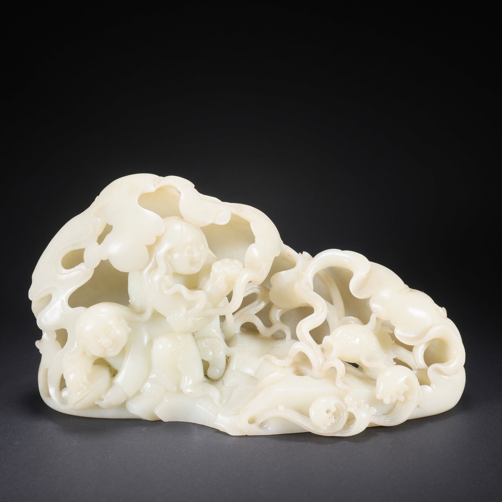 A HETIAN JADE BOY PLAYING WITH FISH ORNAMENT (1 of 9)