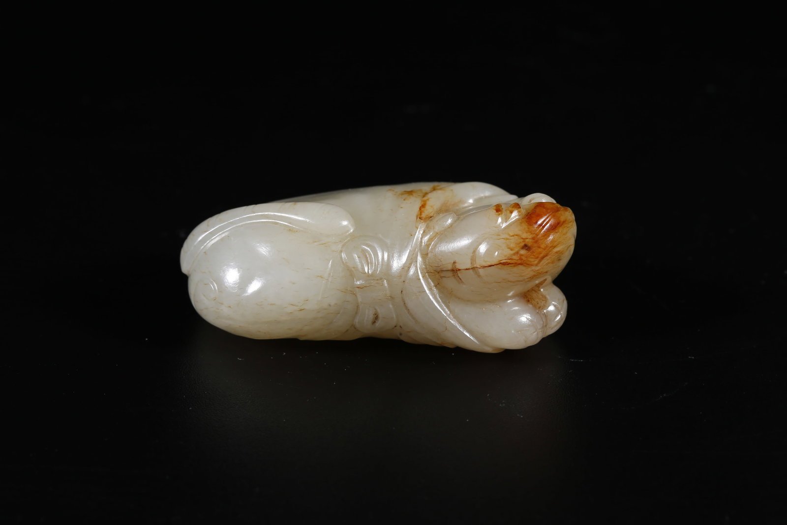 A HETIAN JADE PENDANT IN ANIMAL FORM (1 of 9)