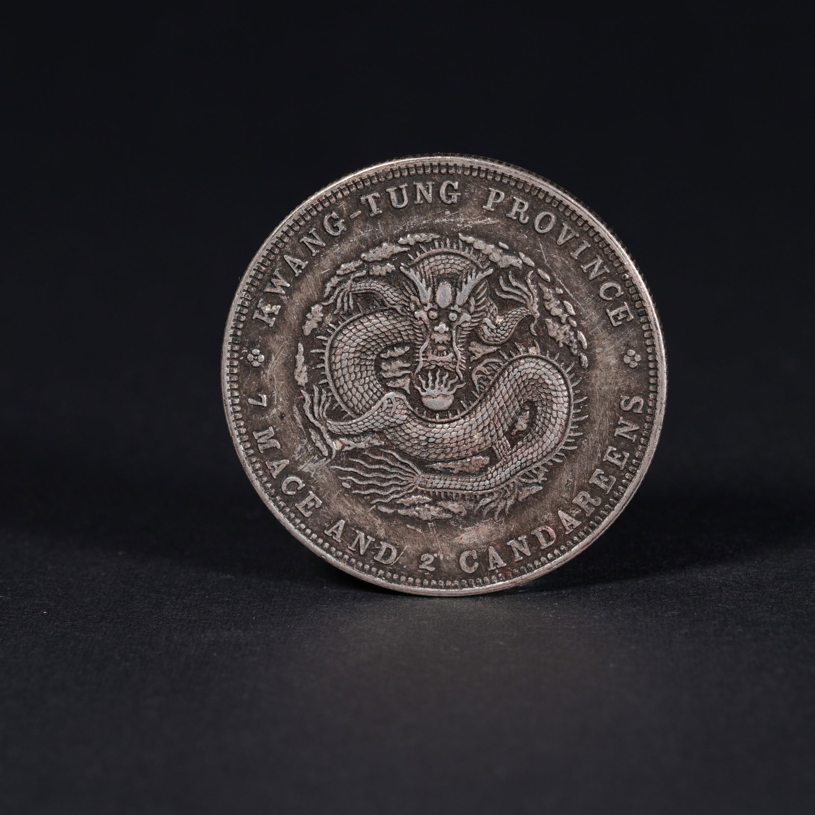 A SILVER DOLLAR COIN: One Silver dollar Coin