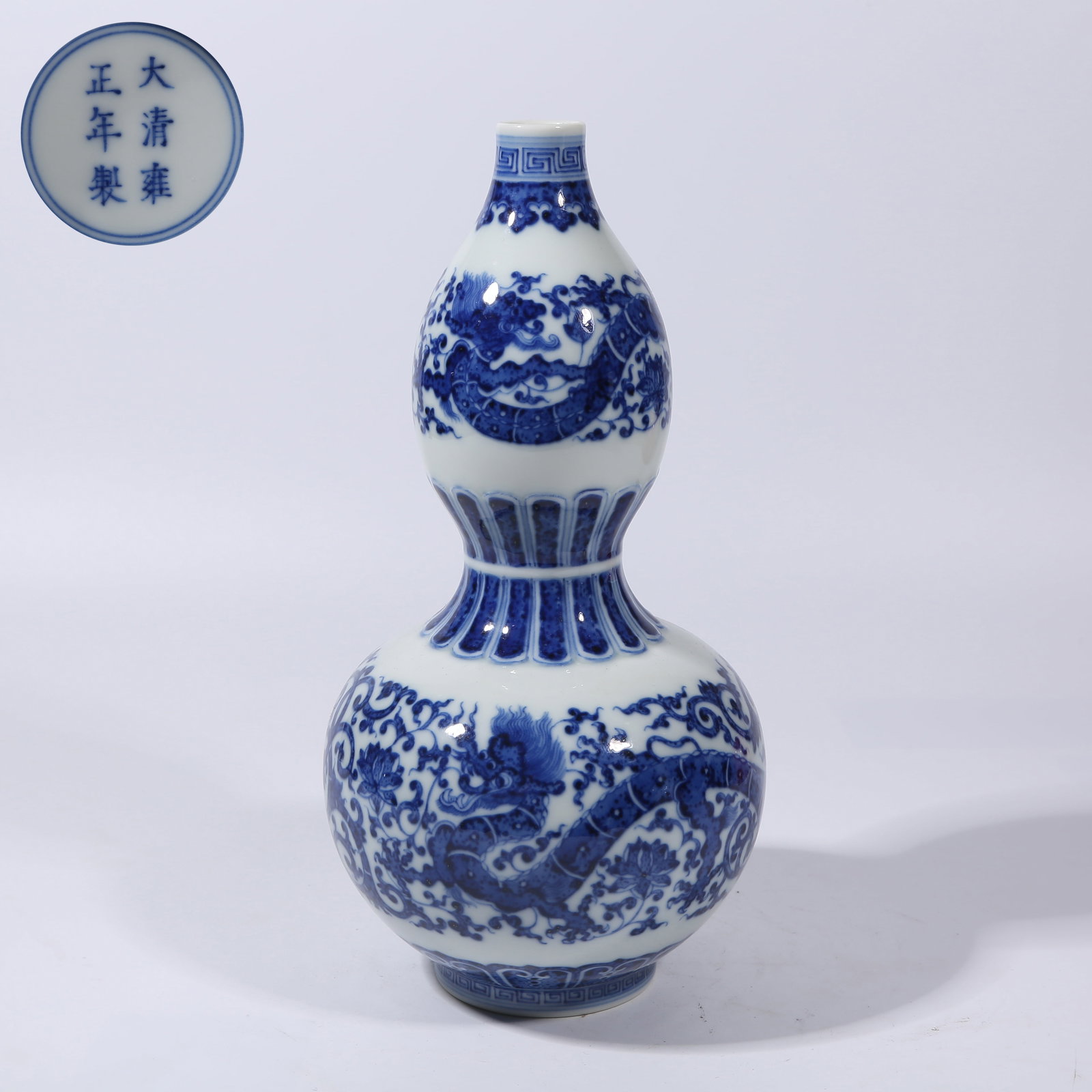 A BLUE AND WHITE "DRAGON THROUGH FLOWERS" GOURD VASE (1 of 9)