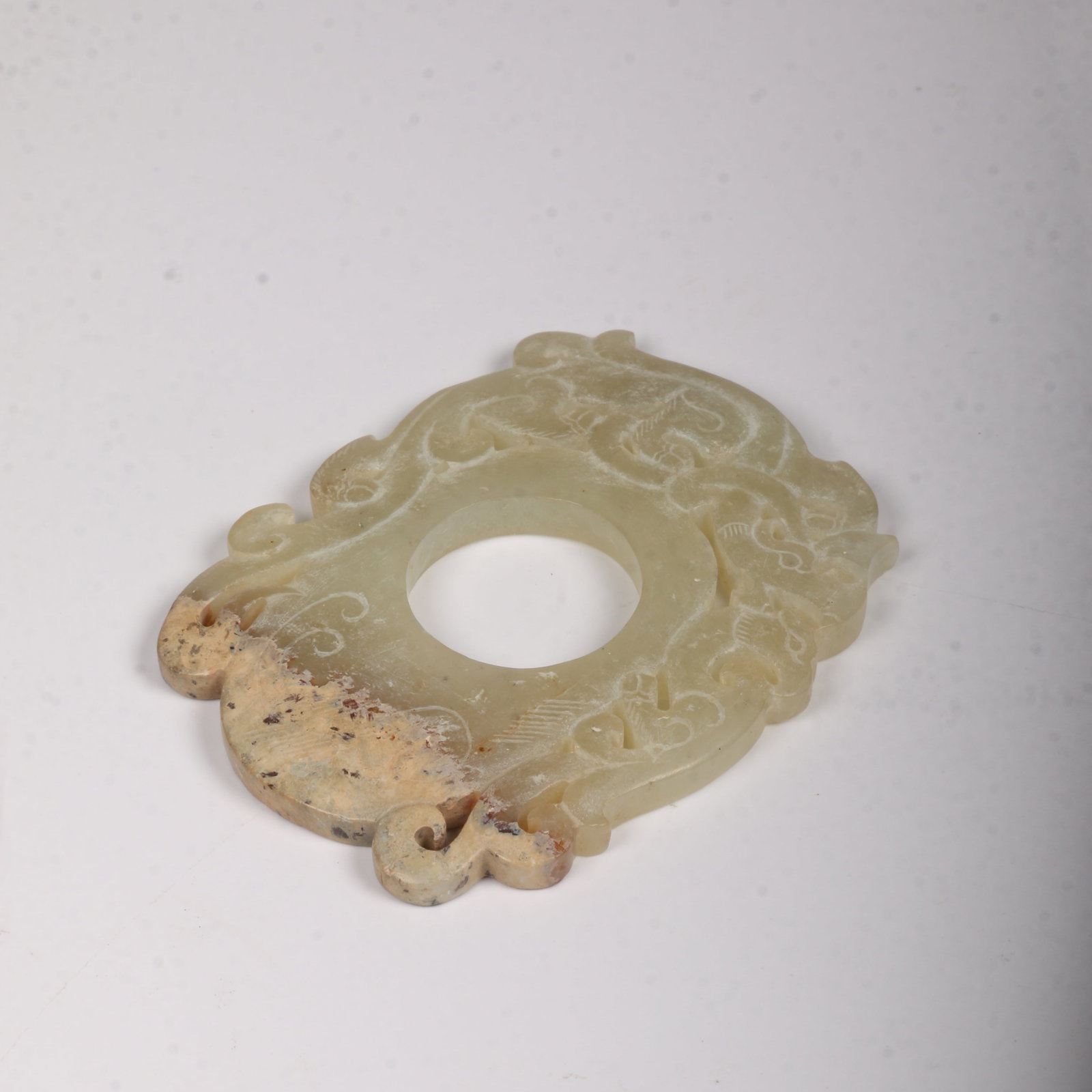 A ANCIENT JADE CHICKEN-HEART PENDANT (1 of 8)