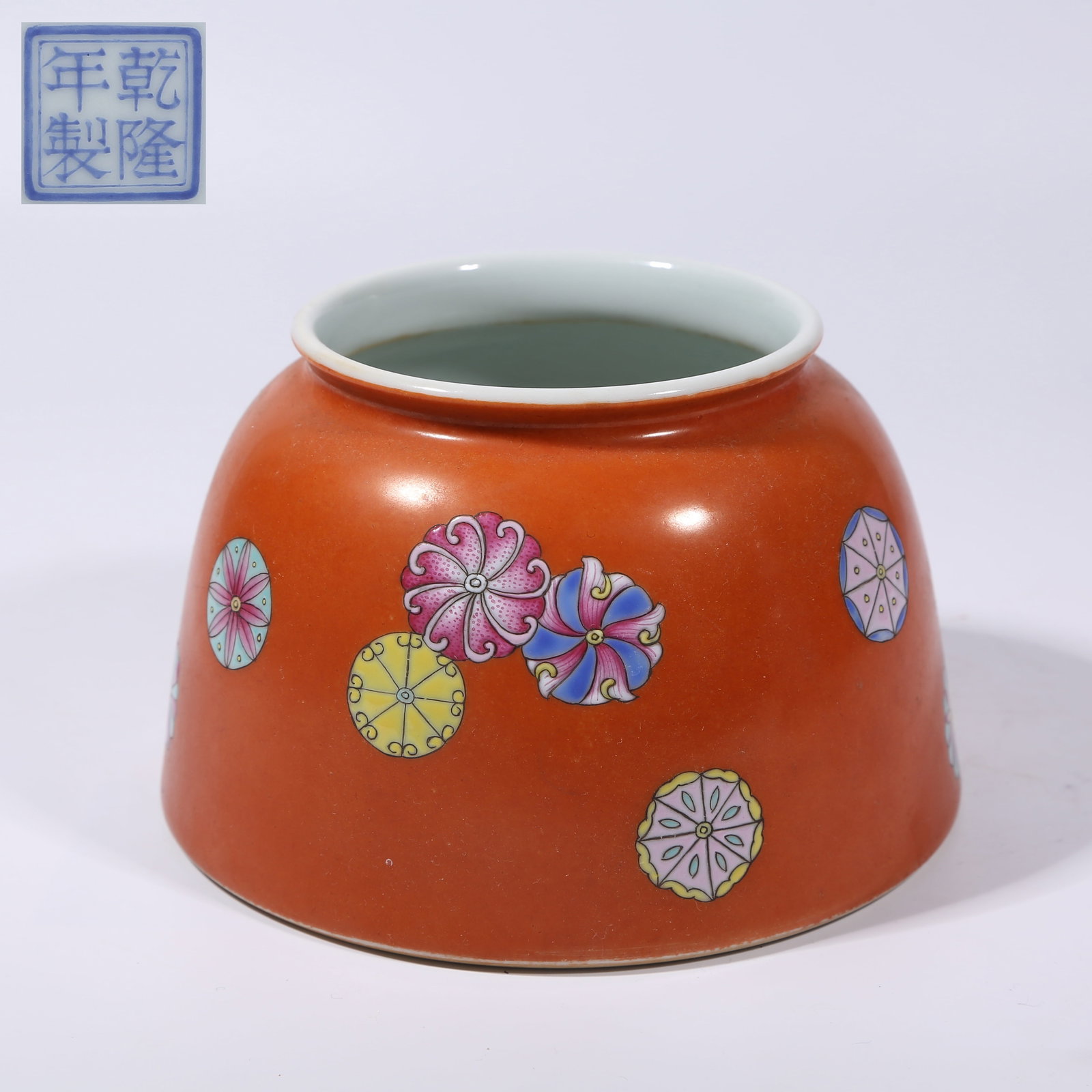 A CORAL-RED GROUND FAMILLE ROSE "RUBBER BALL" FLORAL PATTERN HORSE-HOOF-SHAPED ZUN (1 of 9)
