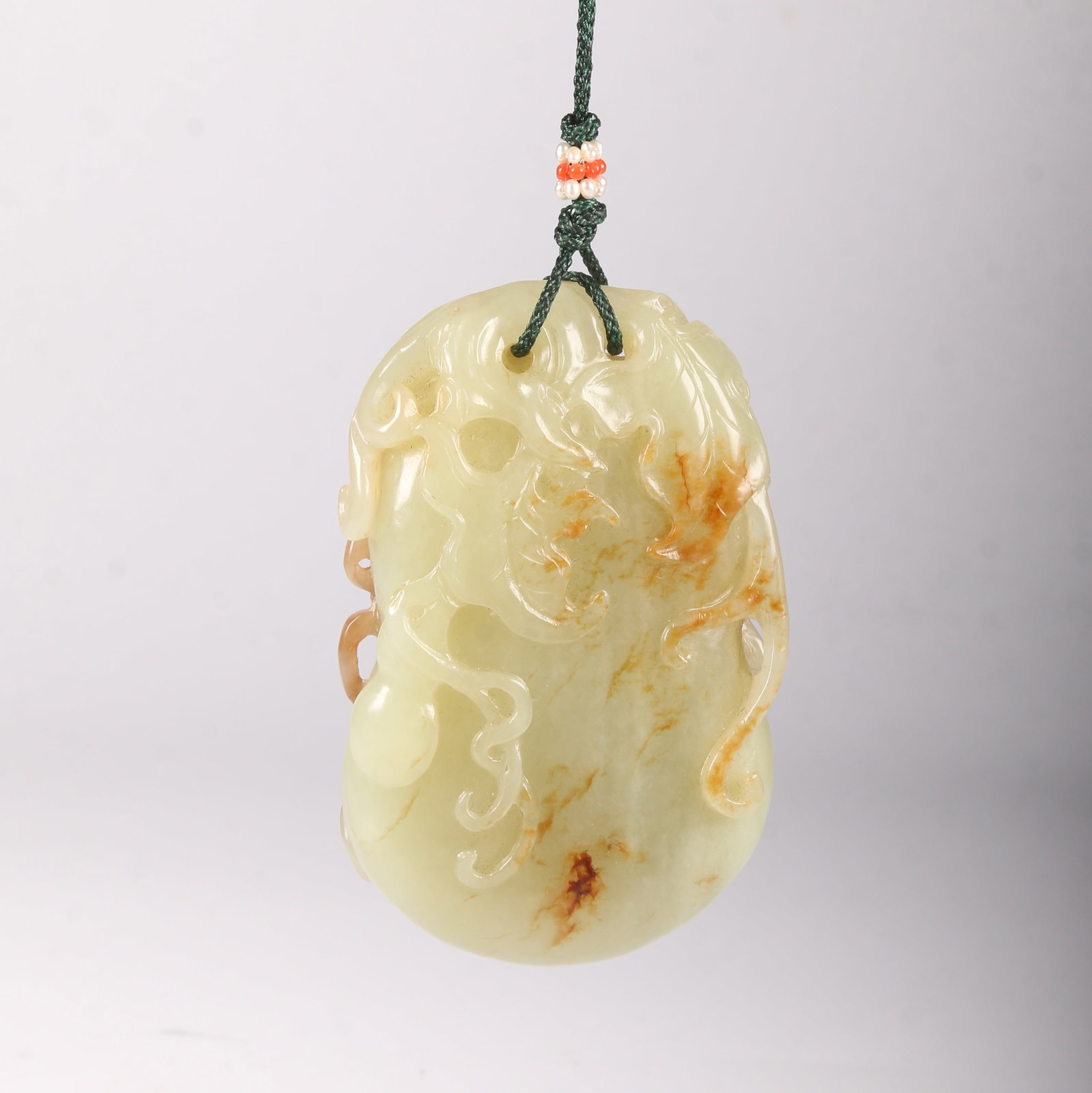 A HETIAN JADE PENDANT WITH FU LU WAN DAI MOTIF (BLESSINGS AND PROSPERITY FOR GENERATIONS) (1 of 11)