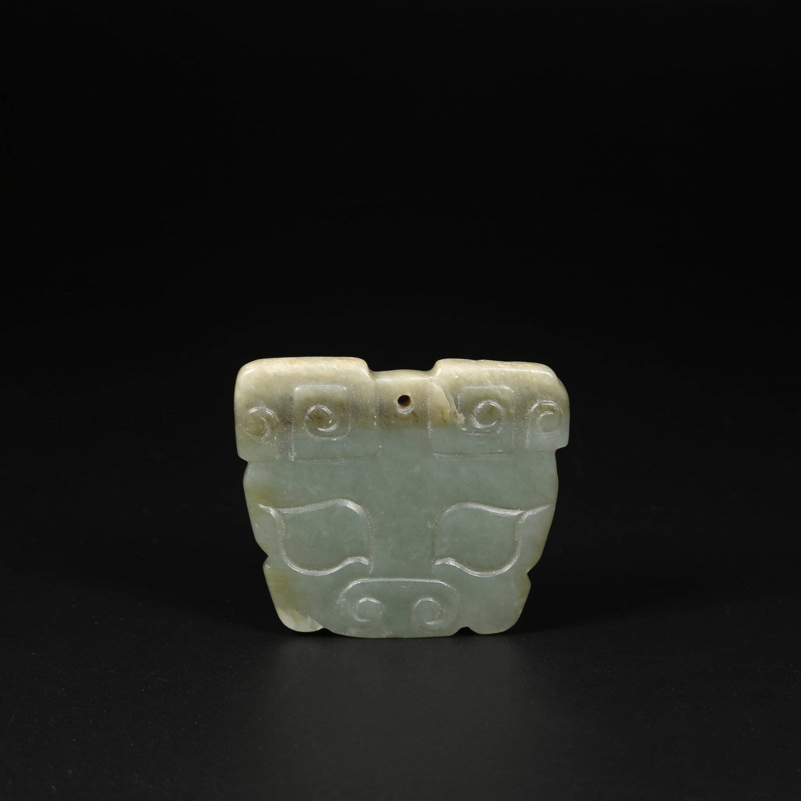 A ARCHAIC JADE BEAST-FACED PENDANT (1 of 5)
