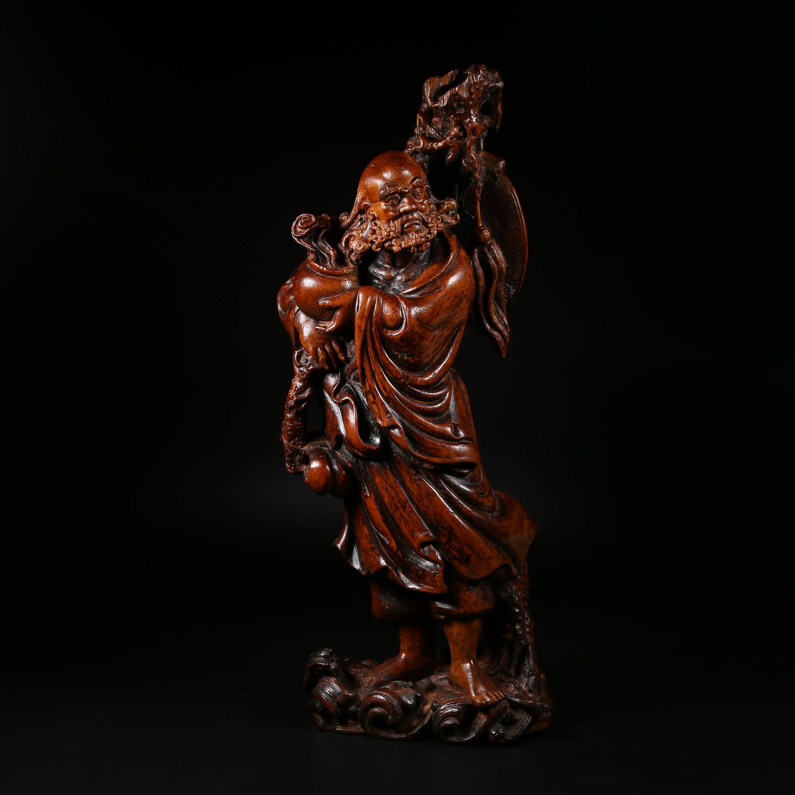 A BOXWOOD BODHIDHARMA FIGURE (1 of 7)