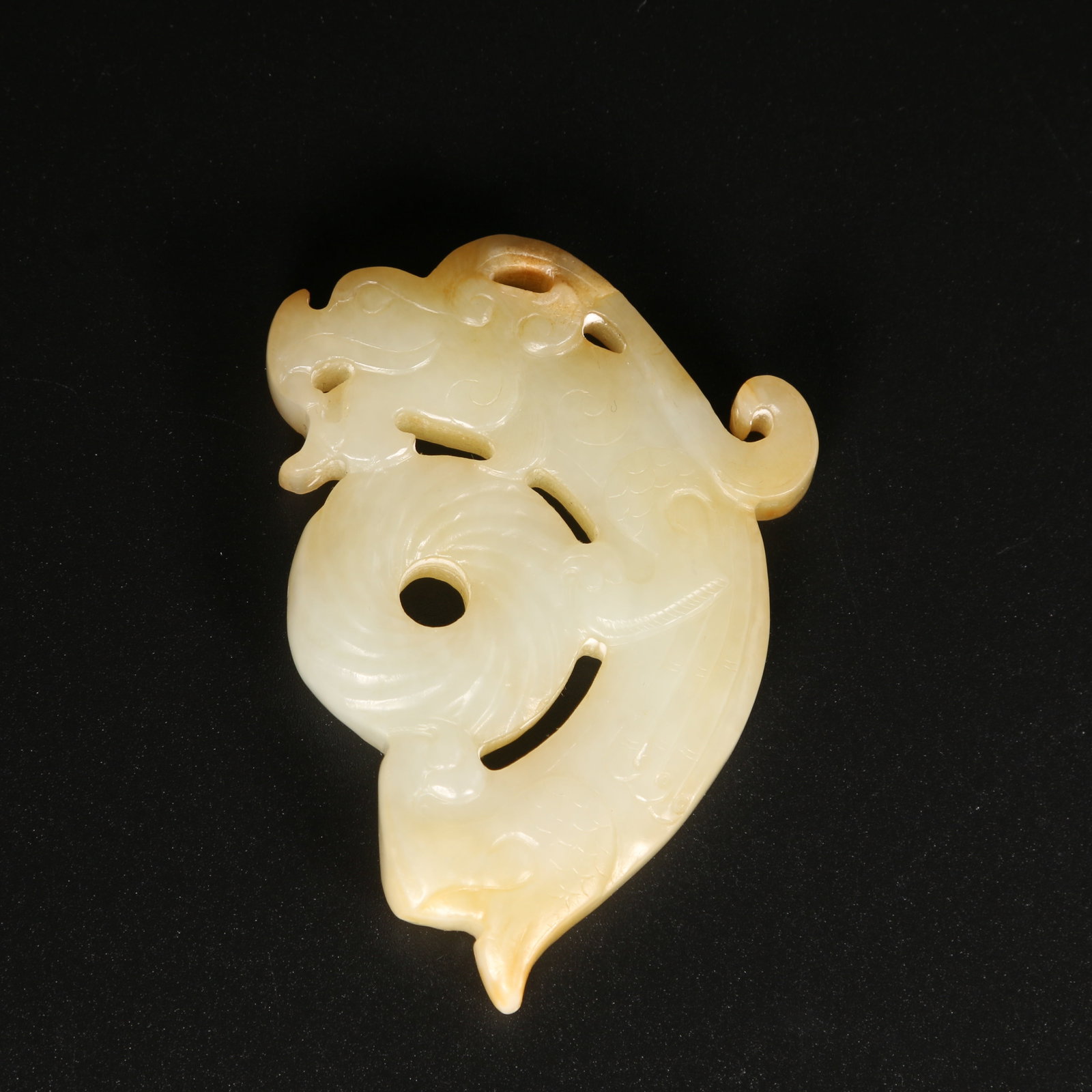 A HETIAN JADE AUSPICIOUS BEAST PENDANT (1 of 9)