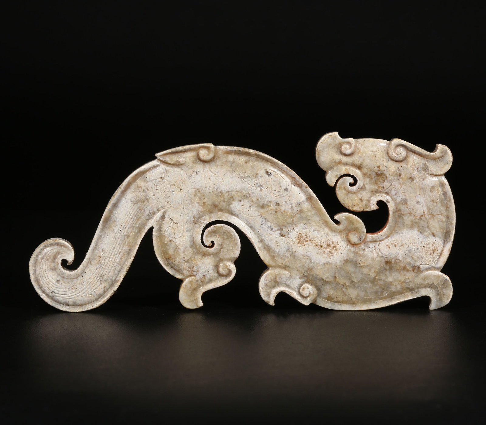 A ARCHAIC JADE DRAGON-SHAPED PENDANT (1 of 7)