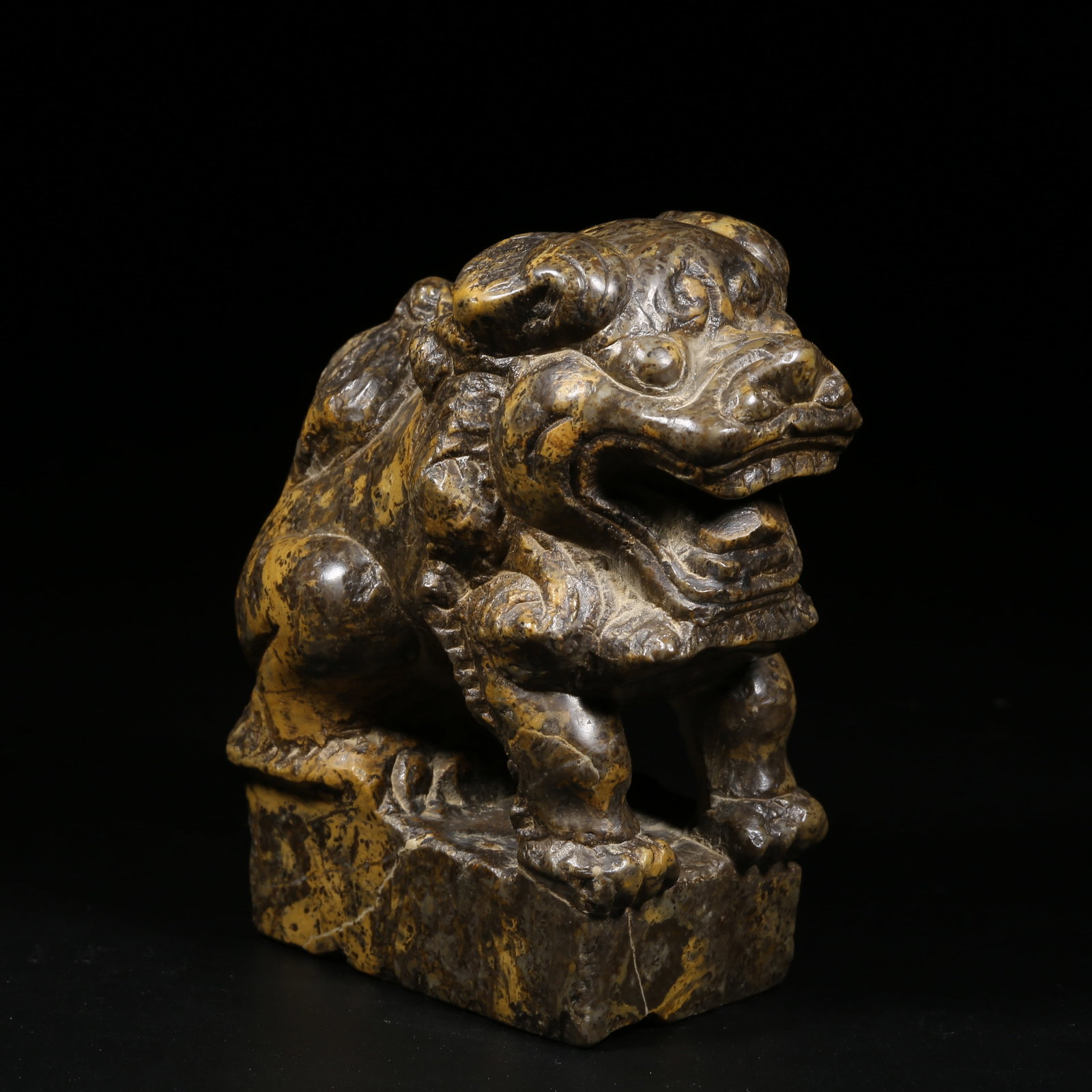 A MULTICOLORED STONE DESK LION: Multicolored Stone Desk Lion