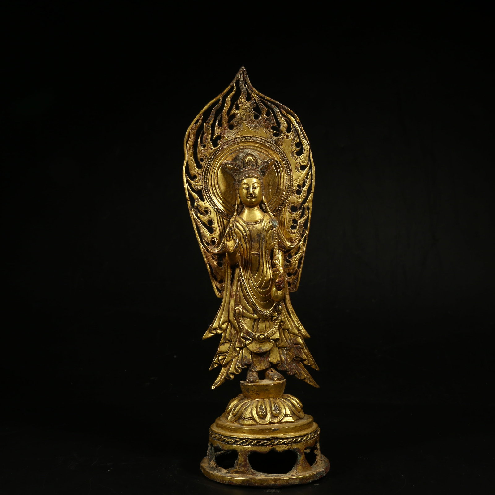 A GILT-BRONZE STANDING FIGURE OF GUANYIN (1 of 8)